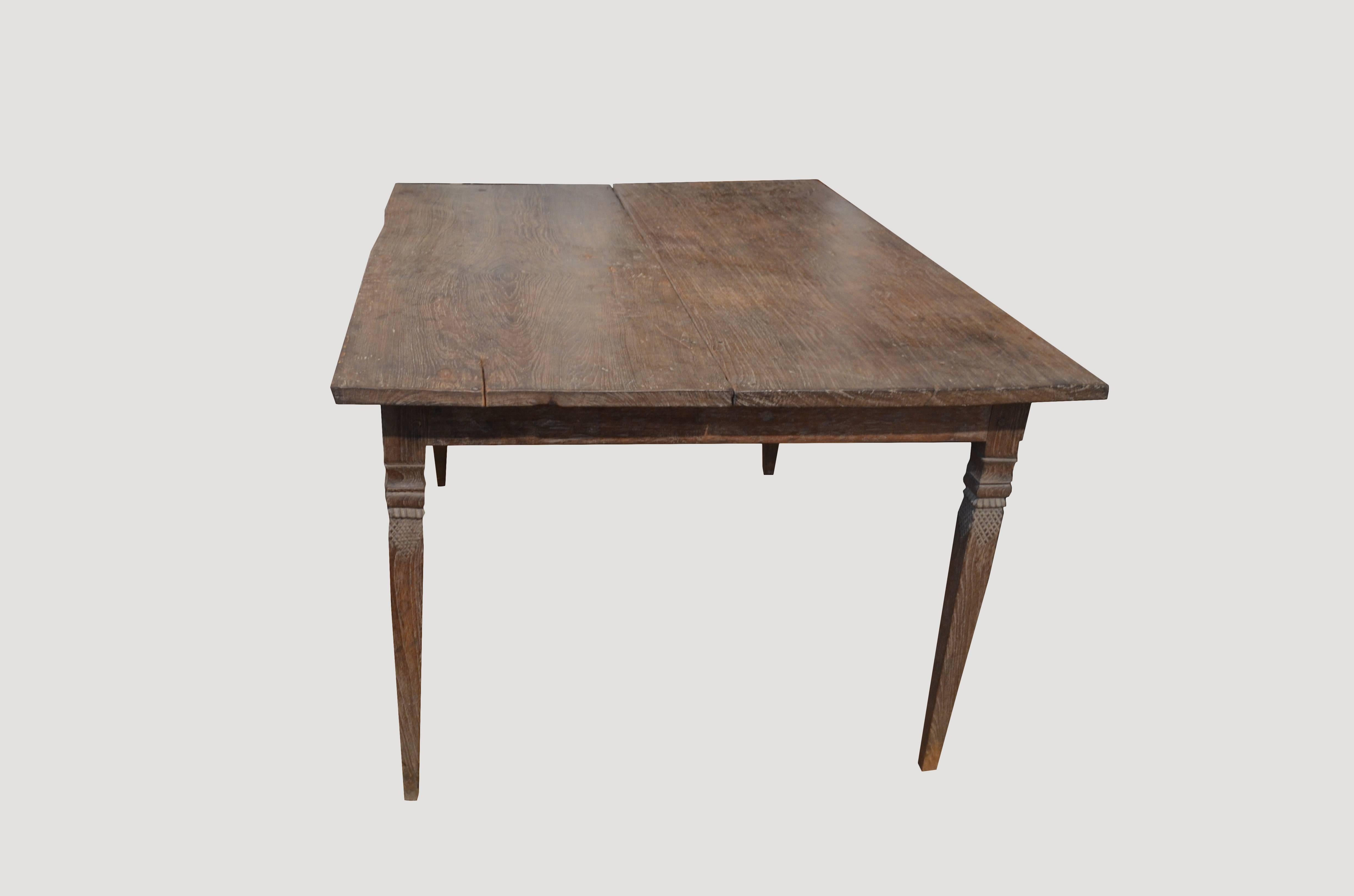Beautiful carved legs on a two plank antique teak wood dining table.

This dining table was sourced in the spirit of wabi-sabi, a Japanese philosophy that beauty can be found in imperfection and impermanence. It’s a beauty of things modest and