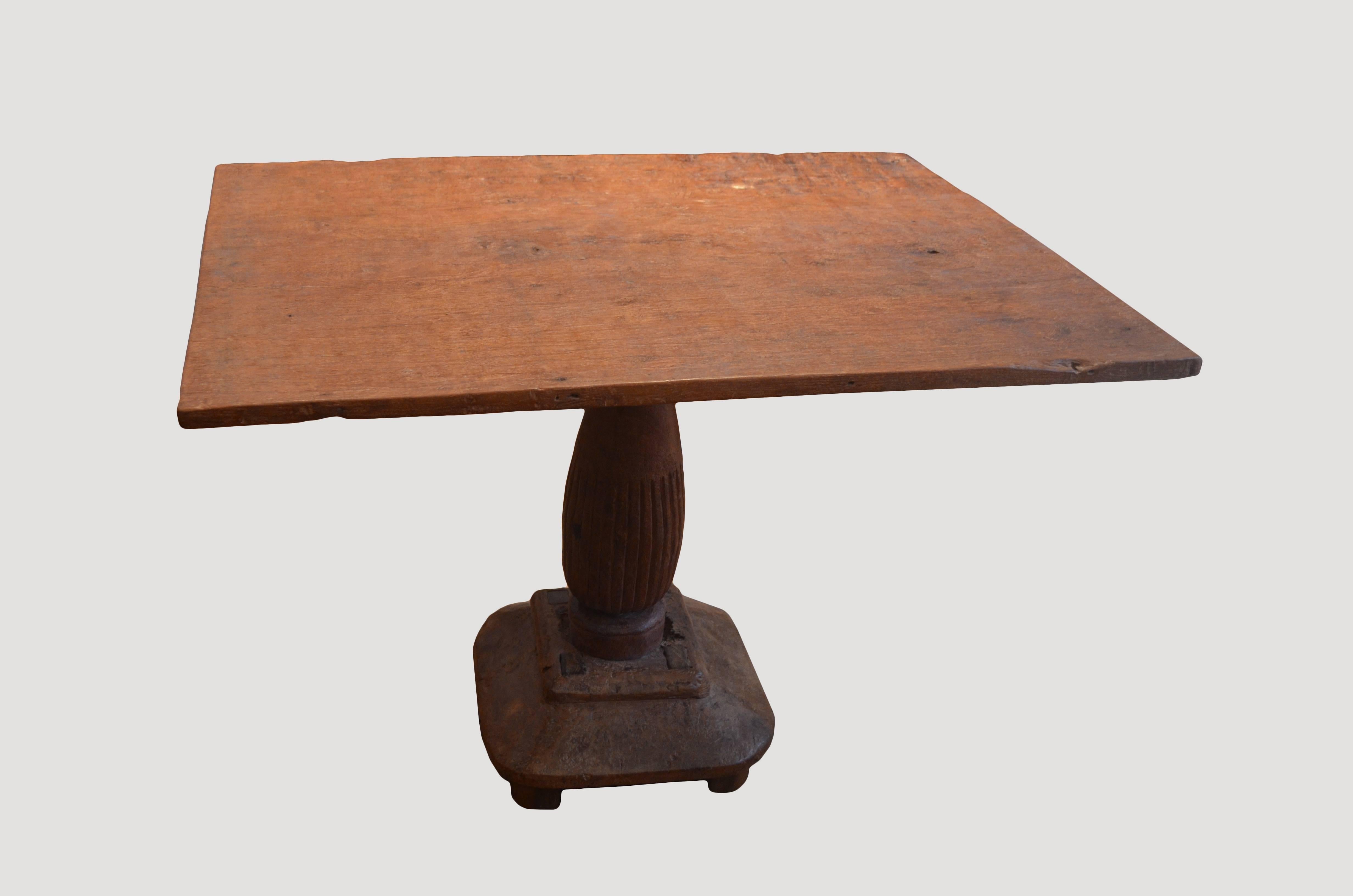 Fabulous single slab top teak wood table, perfect for intimate dining or a large side table. Beautiful hand-carved colonial leg.

This table was sourced in the spirit of wabi-sabi, a Japanese philosophy that beauty can be found in imperfection and
