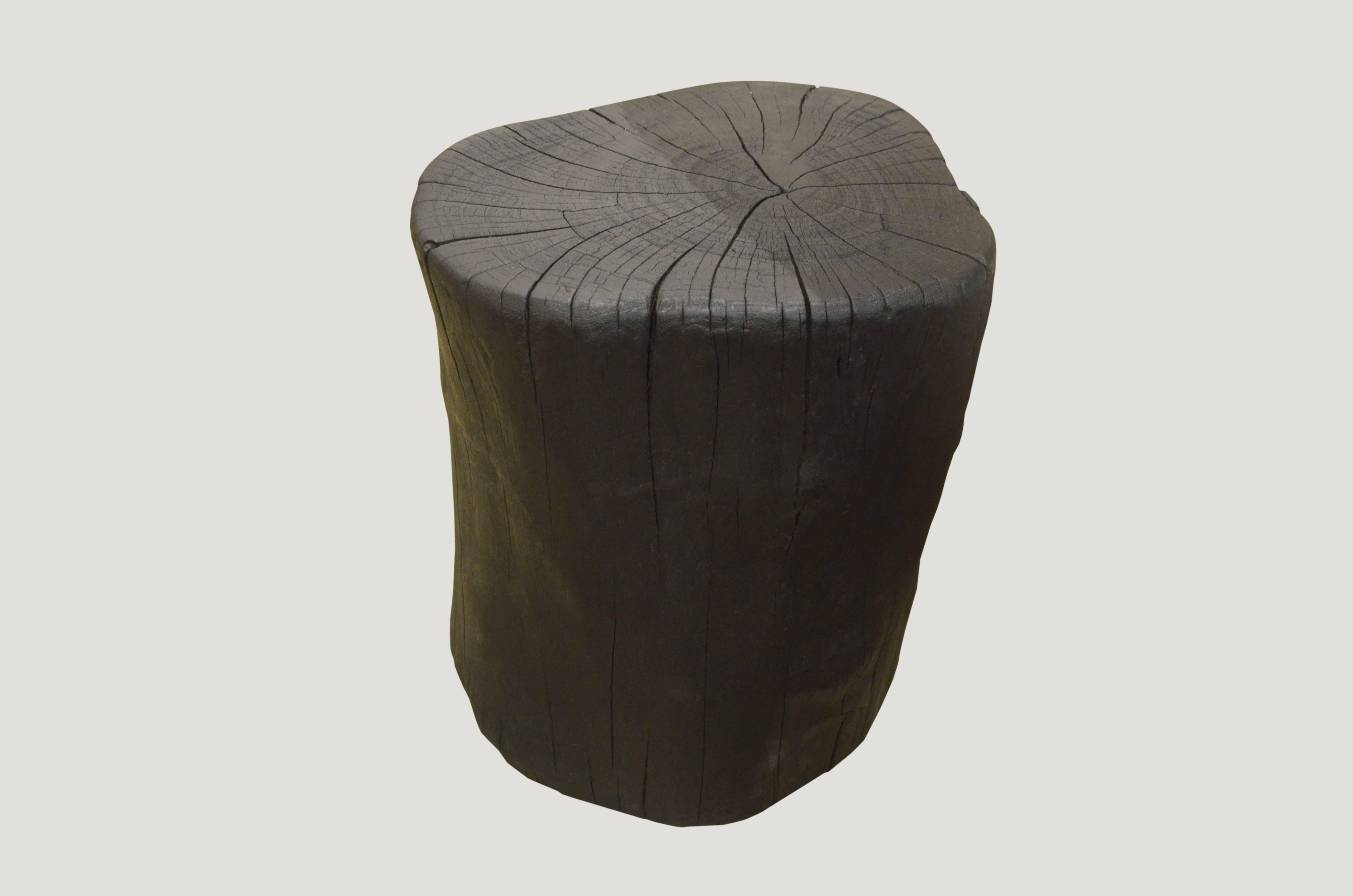 Solid organic shaped reclaimed teak wood side table. Burnt, sanded and sealed with a smooth finish.

The Triple Burnt collection represents a unique line of modern furniture made from solid organic wood. Burnt three times to produce a rich, charcoal