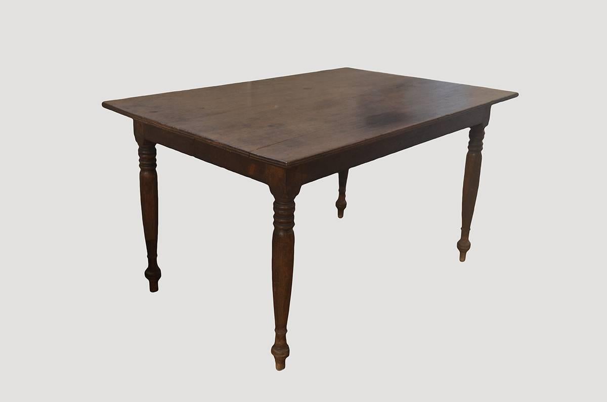 Beautiful patina on this single slab antique teak wood dining table with a hand carved bevelled edge. Perfect as a small dining table, entrance table or desk.

This table was sourced in the spirit of wabi-sabi, a Japanese philosophy that beauty can