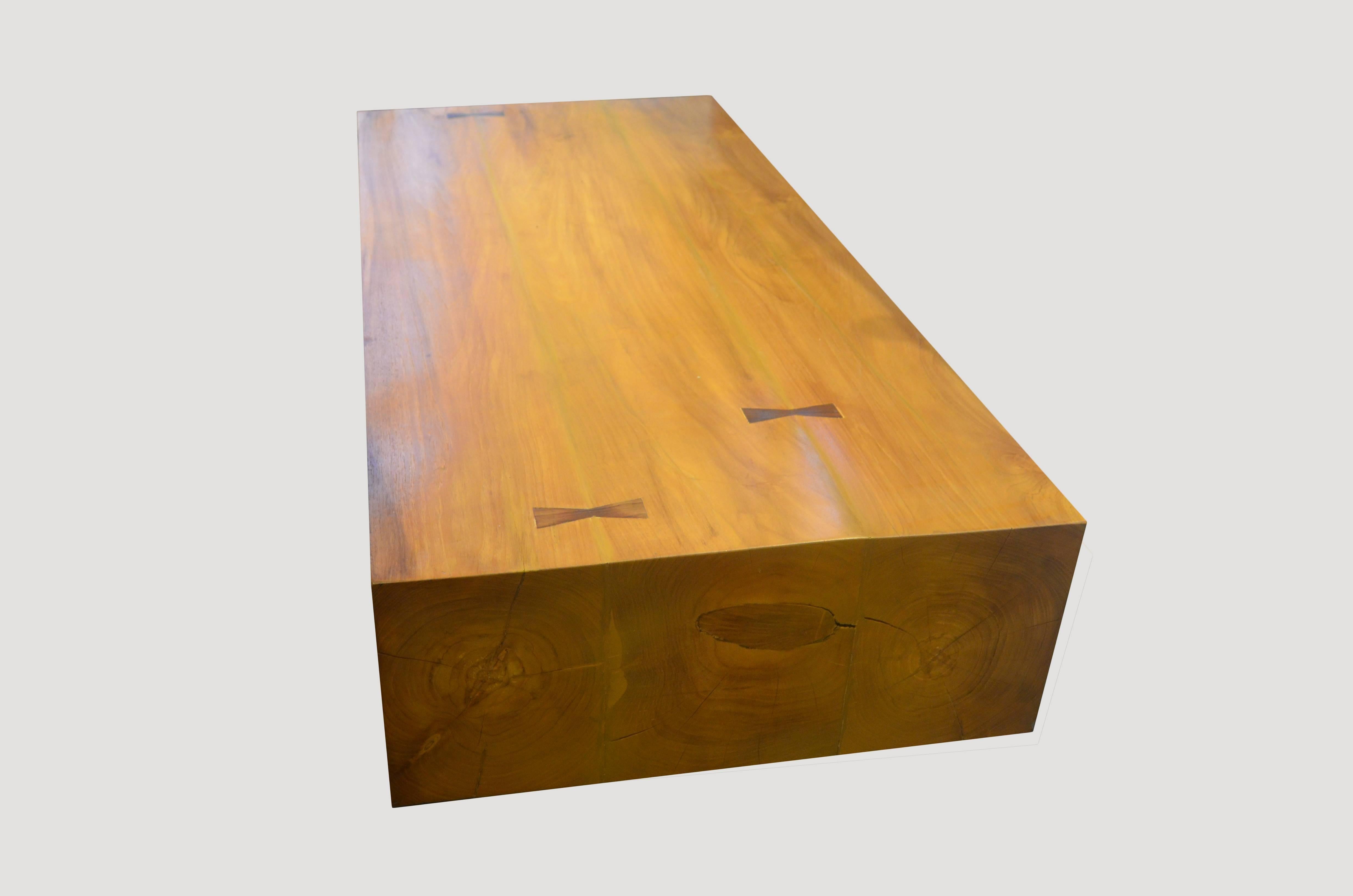 Impressive solid teak wood coffee table with butterfly detail. A two inch inset base allows the top to float off the floor. Shown: Natural polished teak. Custom sizes and finishes available.

Own an Andrianna Shamaris original.

Andrianna Shamaris.