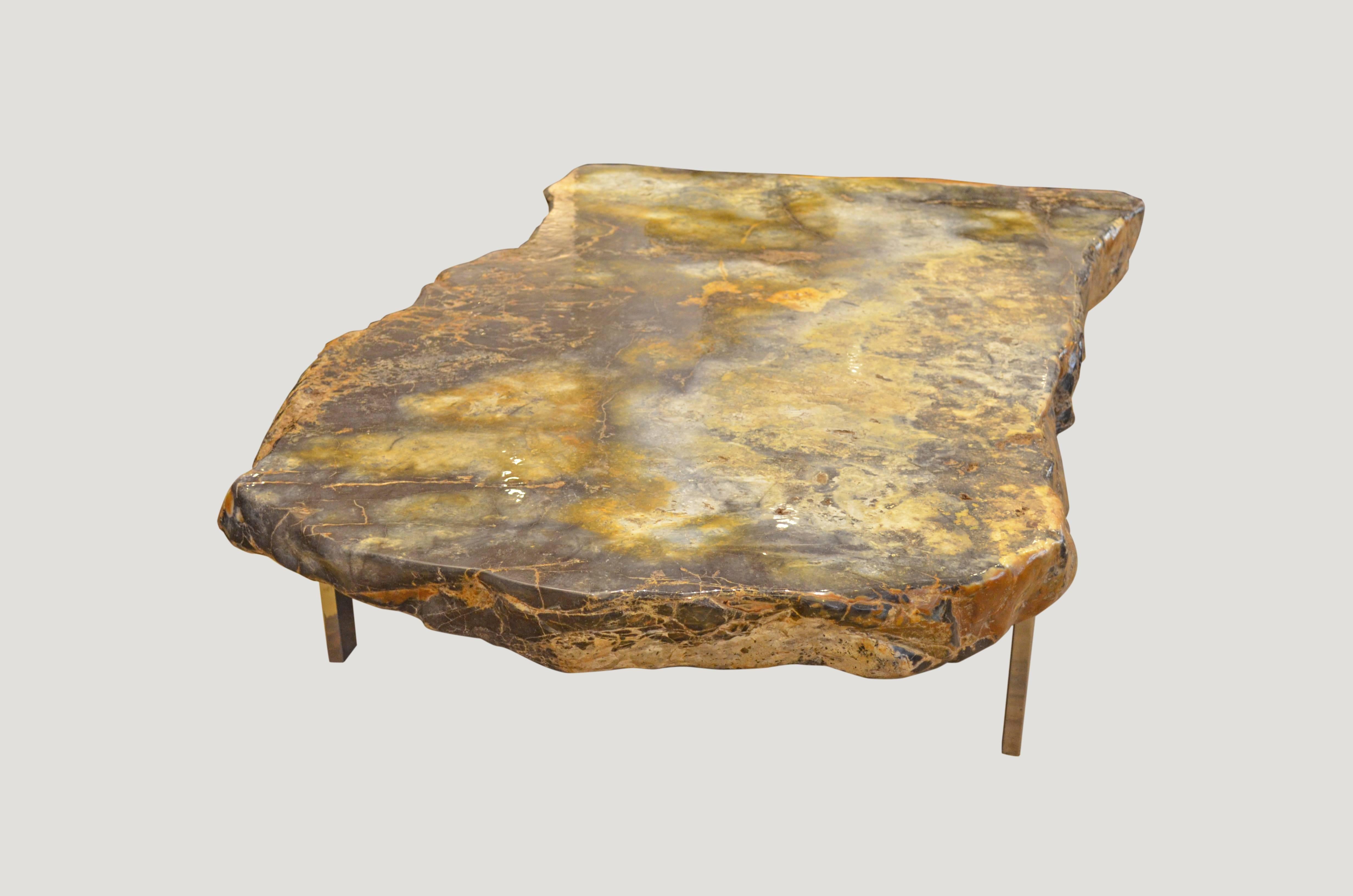 Spectacular single pancawama petrified wood coffee table in stunning indigo, white and olive contrasting tones.

Pancawarna means “five colors” or “multicolored” in Sanskrit and is a term that has been used for centuries to refer to the multicolored