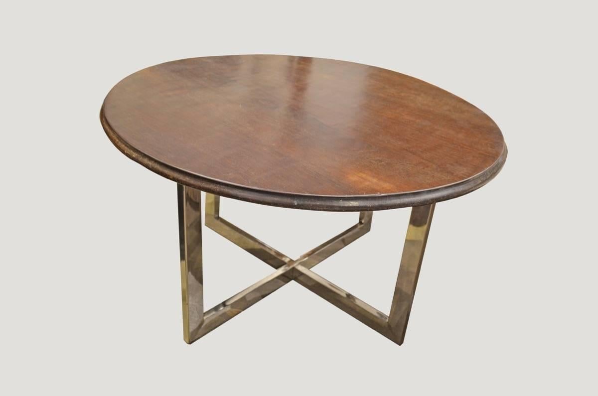 Impressive single ulin wood antique top from Kalimantan with stunning patina and hand-carved beveled edge. We have matched this with a slick modern steel base. Pair available. Price reflects one.

Andrianna Shamaris. The Leader In Modern Organic