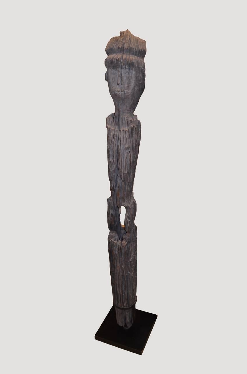 Antique iron wood hand-carved statue set on a modern steel stand from Borneo. Originally used to protect the home.

Andrianna Shamaris. The Leader In Modern Organic Design™