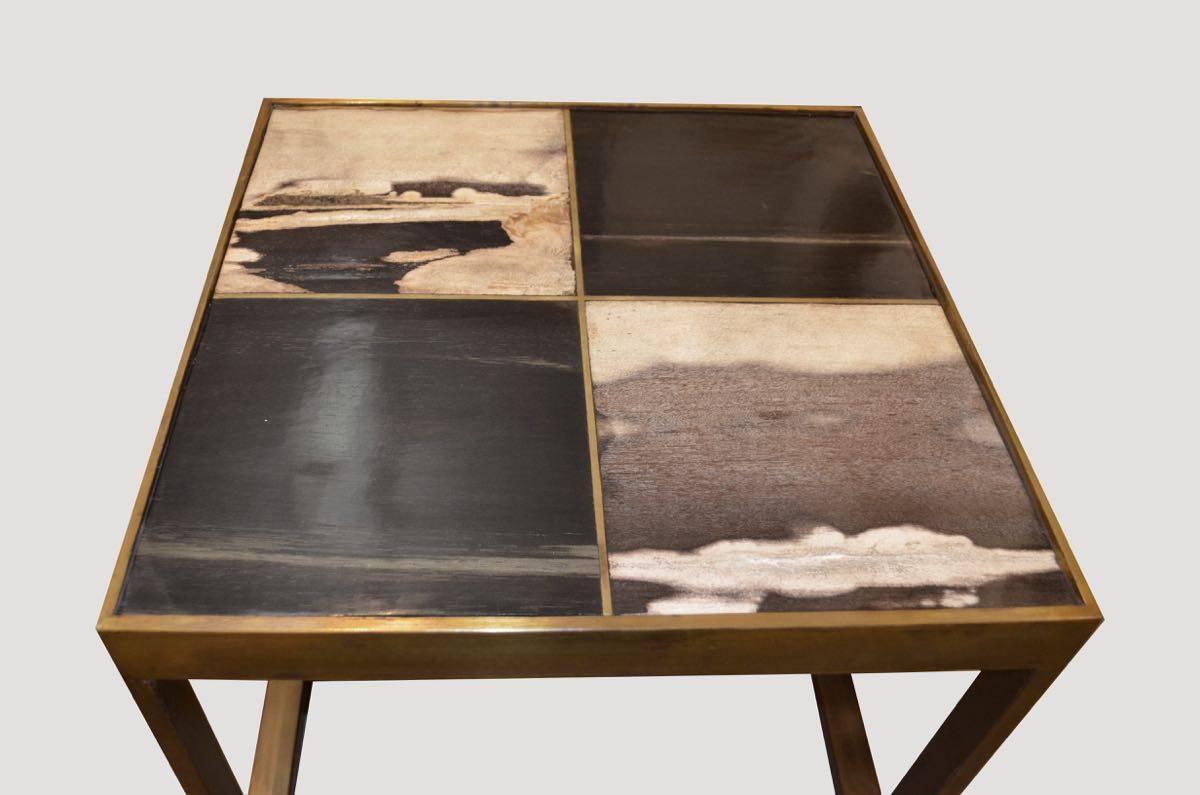 Contrasting slabs of hand-cut petrified wood shown within an antique bronze finish frame. We source the highest quality petrified wood available. Each piece is hand-selected and highly polished with minimal cracks. Petrified wood is extremely