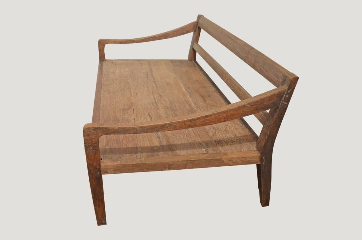 Andrianna Shamaris daybed in the style of Wabi Sabi. Minimal carving with beautiful patina. The arm is hand-carved from a single piece of aged teak wood. Perfect for inside or outside relaxation.

This daybed was sourced in the spirit of wabi-sabi,