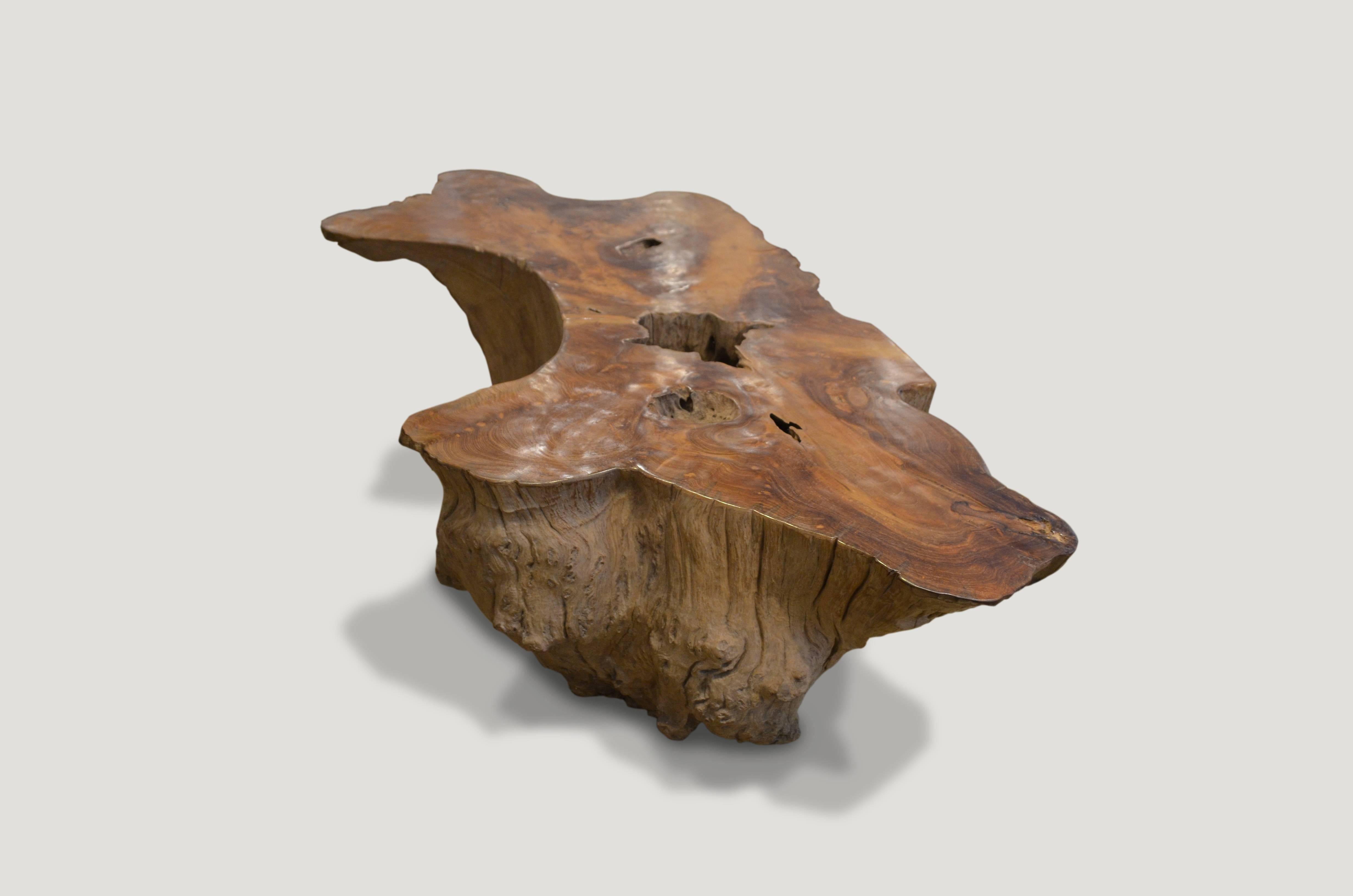 Solid reclaimed teak root coffee table. We polished the top and left the sides raw.

Measures: 62 x 31 – 18 wide x 15″ high.
