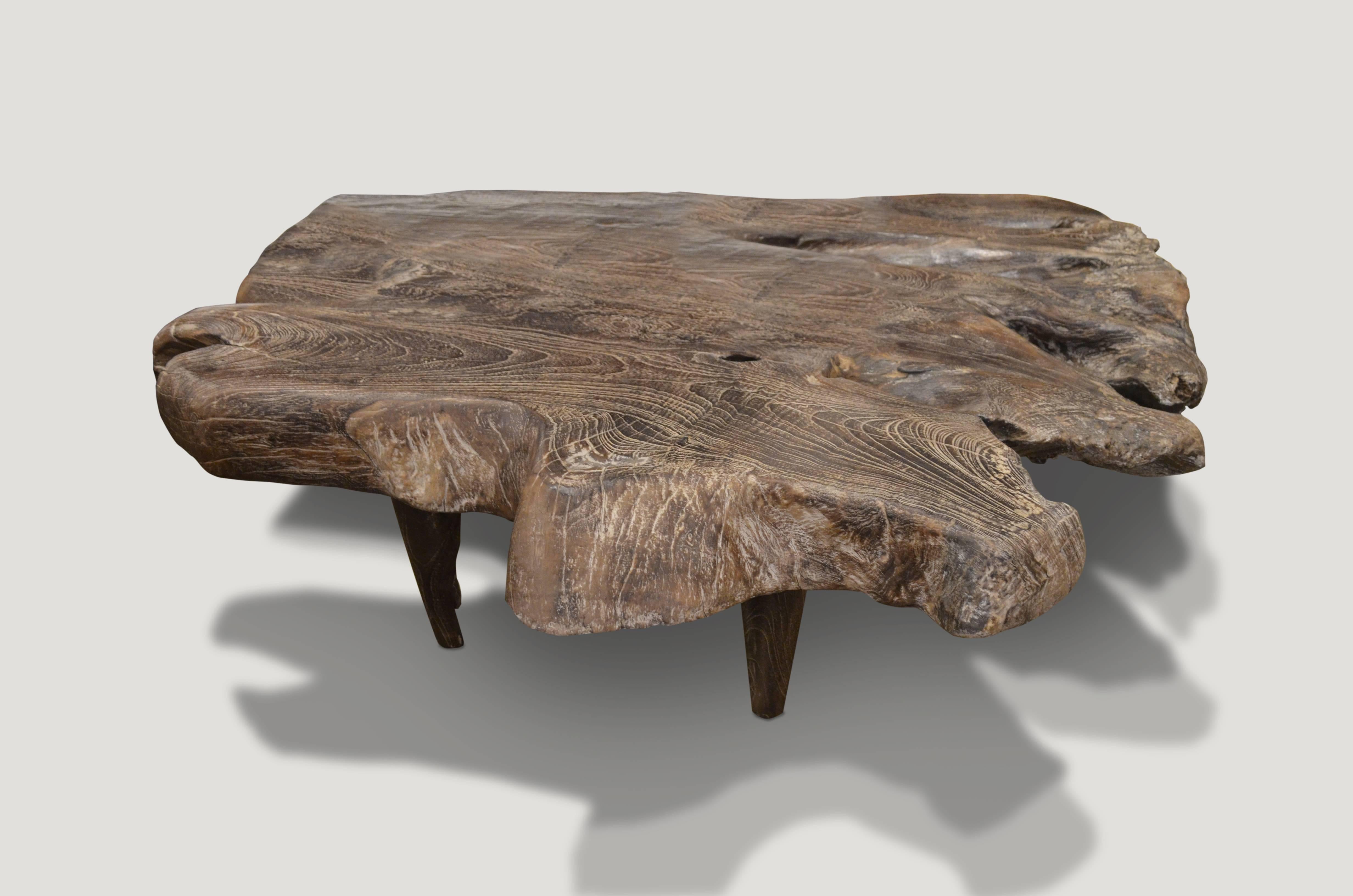 Solid reclaimed teak burnt one time, then sanded and sealed with a cerused finish. Unlike the Triple Burnt Collection which is charred to an espresso finish, this coffee table has been burnt one time to produce a chocolate brown. This impressive