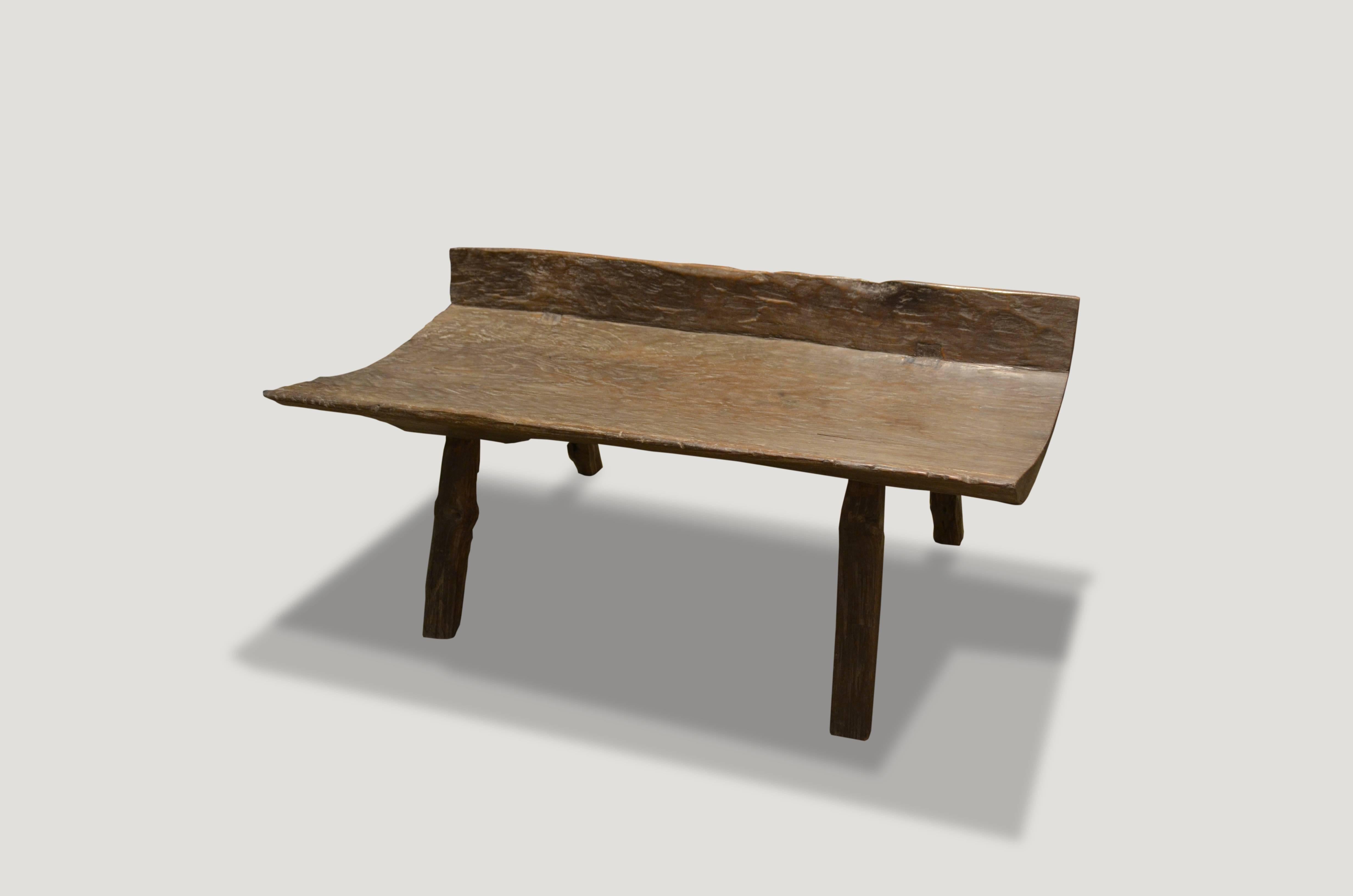 Antique Primitive bench hand-carved from a single slab of teak aged wood with beautiful patina.

This bench was sourced in the spirit of wabi-sabi, a Japanese philosophy that beauty can be found in imperfection and impermanence. It’s a beauty of