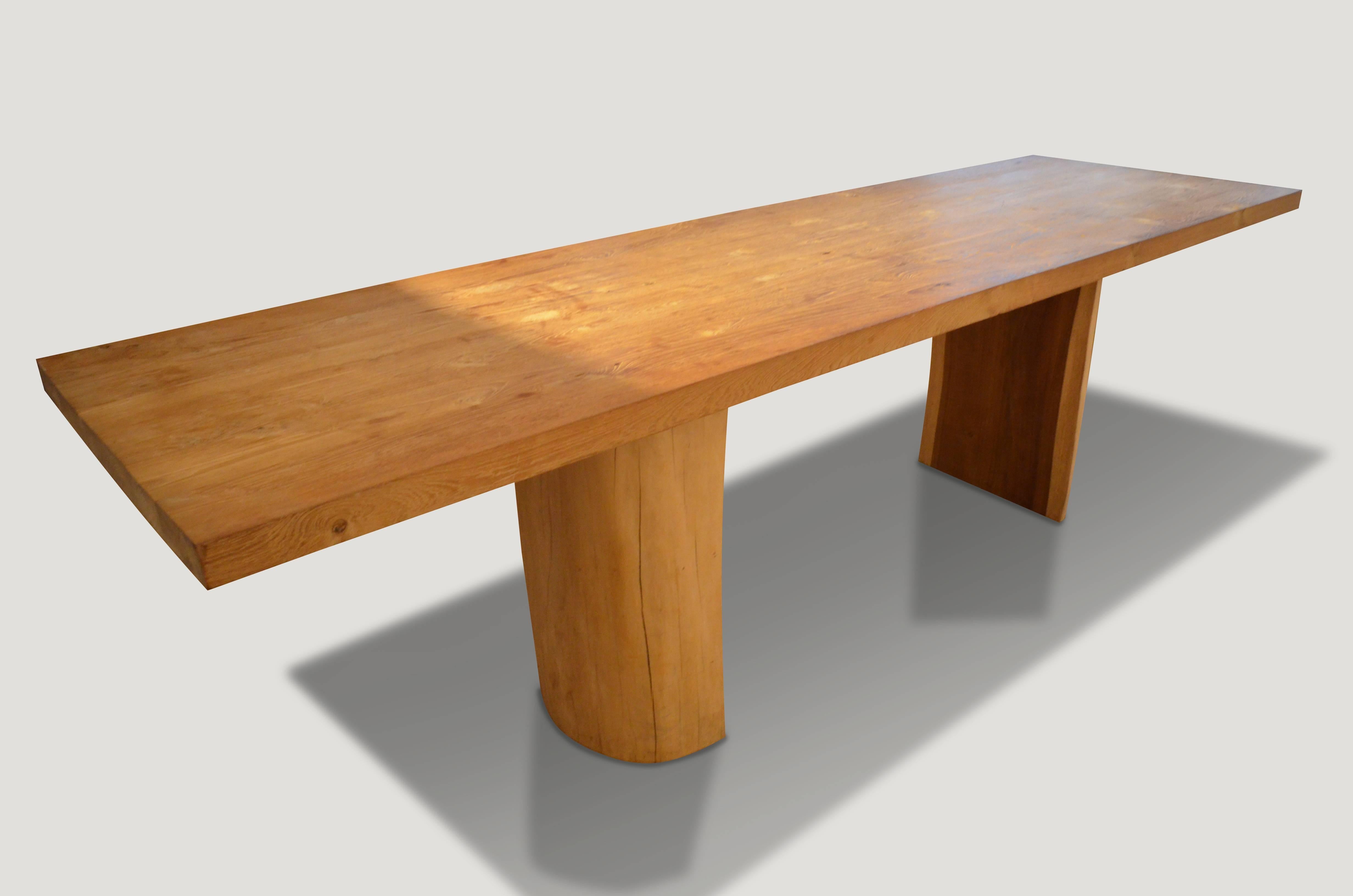 Reclaimed natural teak top dining table with sono wood base. Clean modern lines on this 2.5” thick top. Measures: 120 x 35 x 2.5