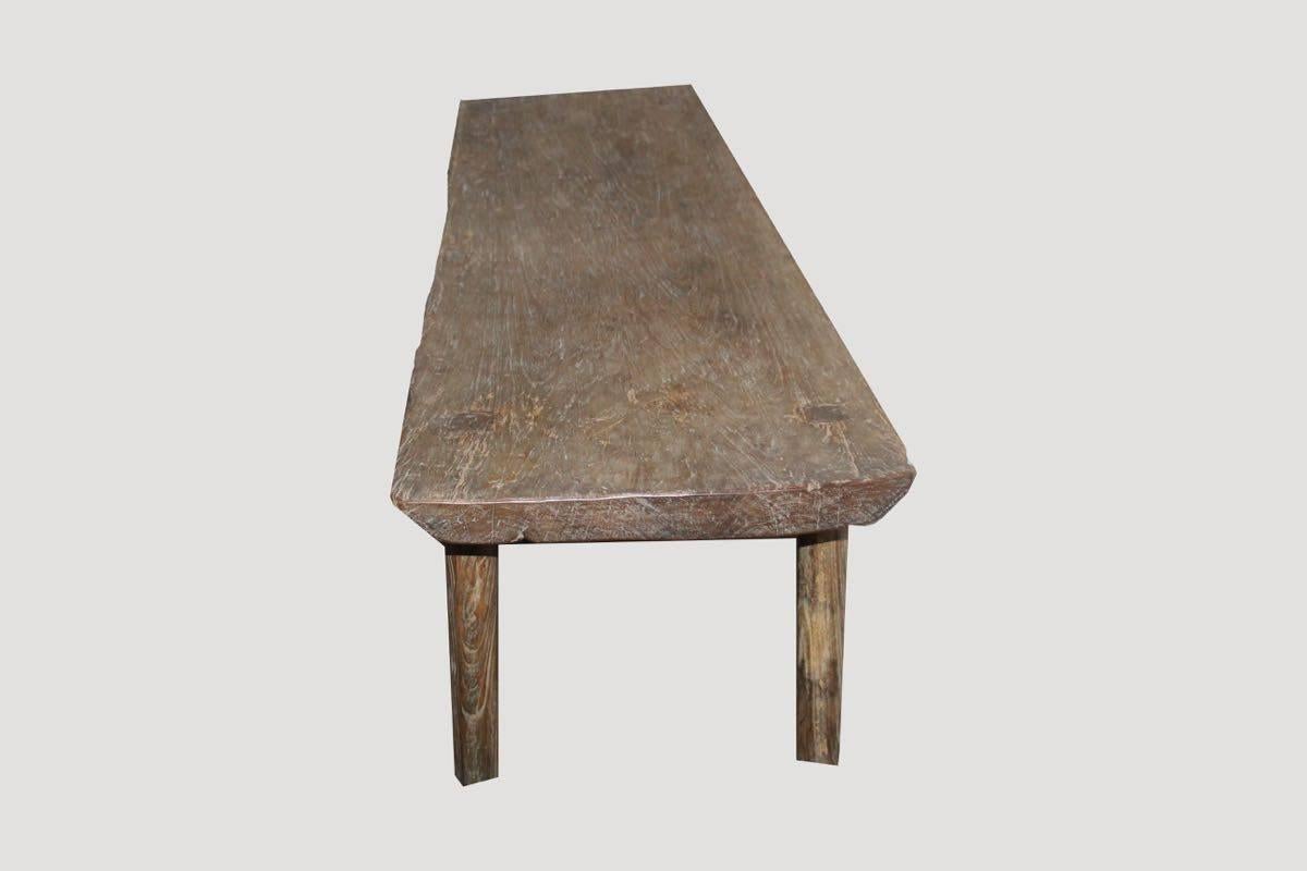 Antique bench or coffee table carved from a single 21″ wide teak slab with beautiful patina.

This bench or coffee table was sourced in the spirit of wabi-sabi, a Japanese philosophy that beauty can be found in imperfection and impermanence. It’s