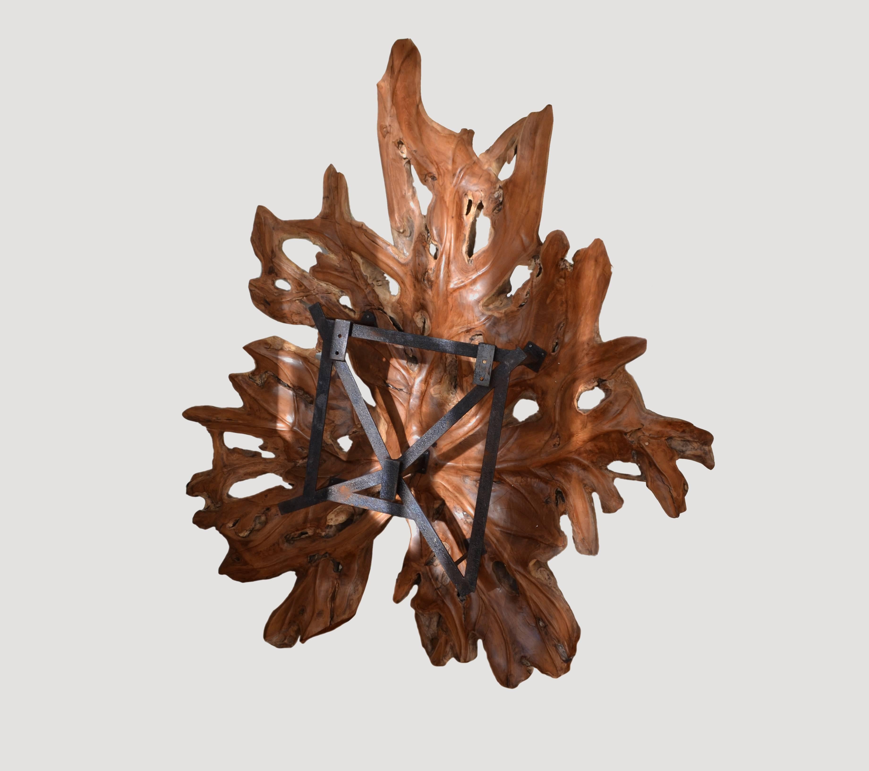 Giant organic teak wood leaf sculpture. Hand-carved from a single slab. This is a beautiful wall sculpture that comes with the hardware as seen. Recessed, with lights behind, it will be a fabulous light fixture.

Andrianna Shamaris, Inc. The Leader