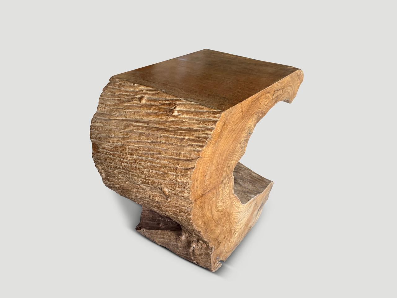 Impressive sculptural console or pedestal hand made from beautiful century old teak wood. Fabulous on both sides. We cut the wood and polished the smooth section with a natural oil revealing the unique wood grain. We have a pair cut from a single