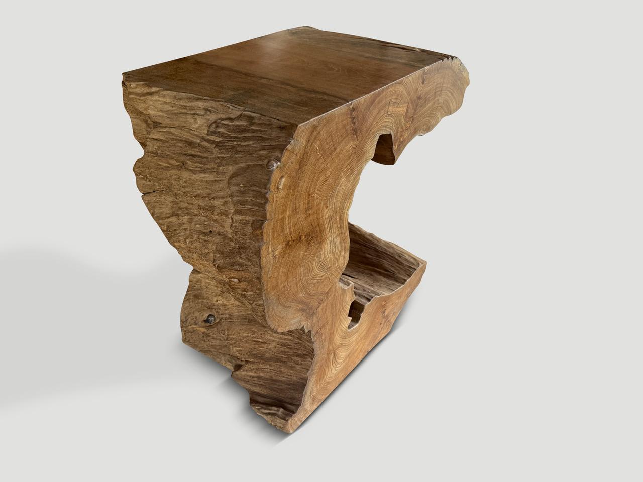 Impressive sculptural console or pedestal hand made from beautiful century old teak wood. Fabulous on both sides. We cut the wood and polished the smooth section with a natural oil revealing the unique wood grain. We have a pair cut from a single