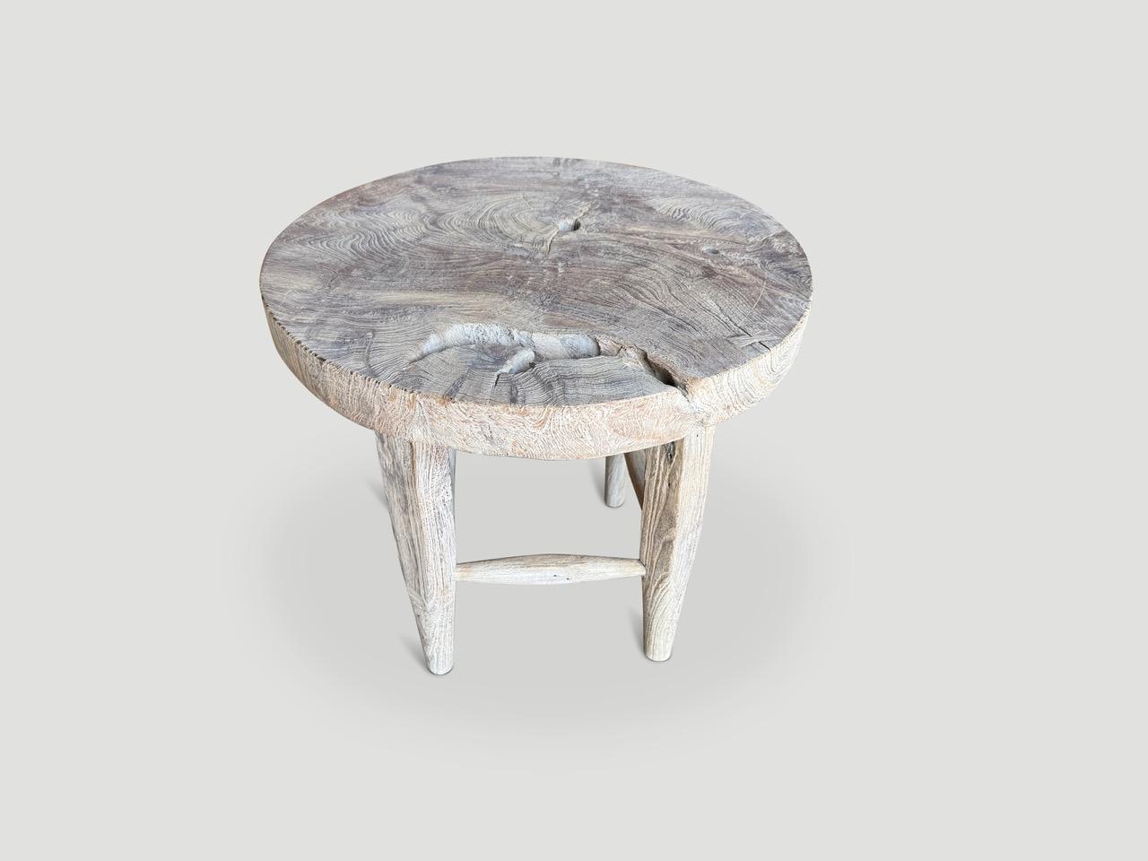 An impressive thick piece of aged teak wood from my private collection, is hand carved into this unique side table, whilst respecting the natural organic wood.  We added bevelled legs, a light ceruse and our secret ingredient, revealing the