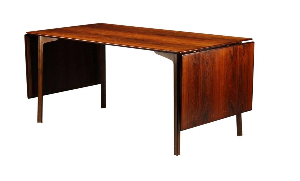Arne Jacobsen 'Grand Prix' dining table in Brazilian rosewood, rectangular top with two drop leaves. Made by Fritz Hansen, model FH 4605, with maker's stamp. 

The table was awarded the Grand Prix at the Trianale in Milan, 1957.

Discounted