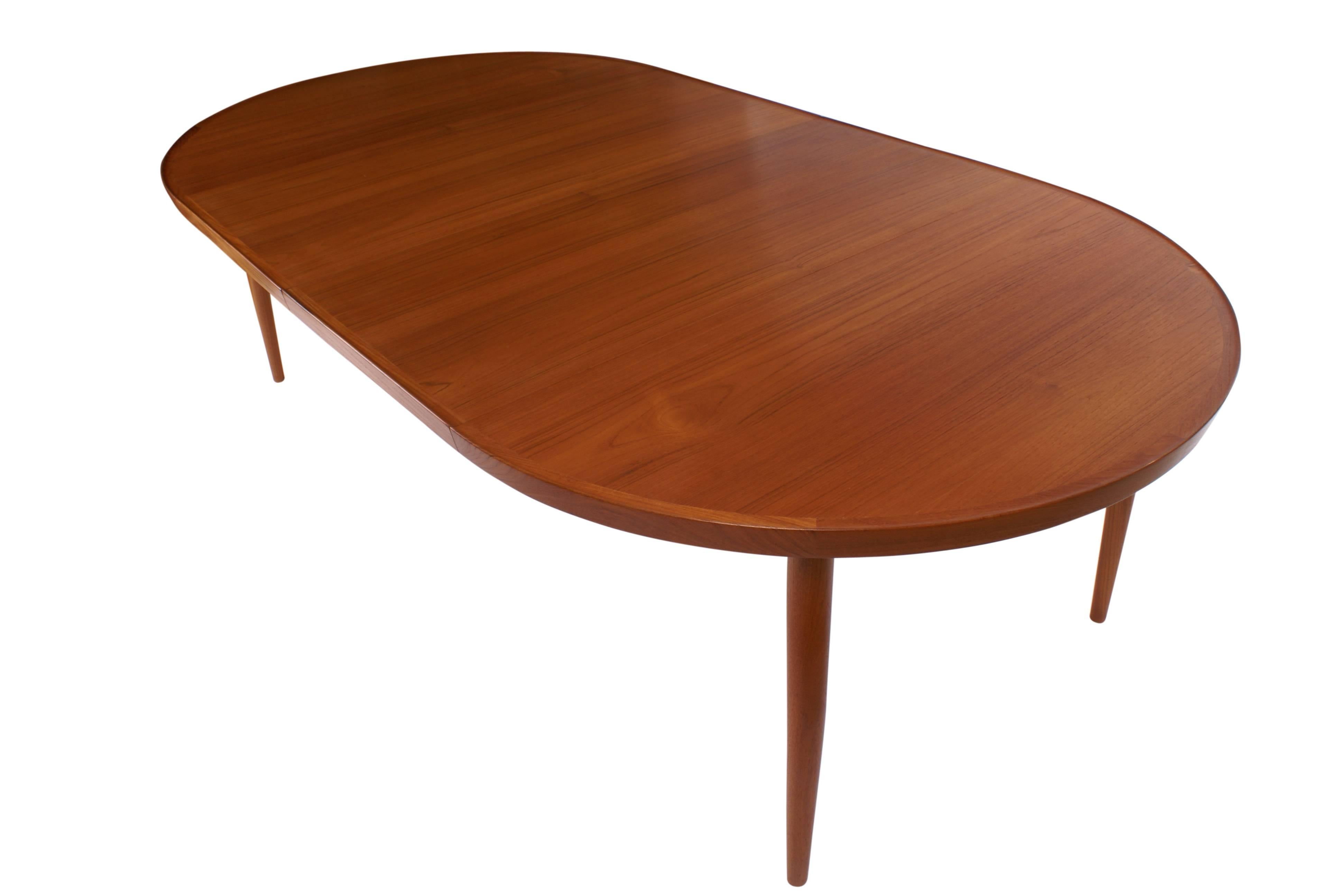Finn Juhl NV56 extendable dining table by Niels Vodder in teak, model NV56, designed 1956.

Executed by master cabinetmaker Niels Vodder, Copenhagen, Denmark. Underside branded 'Niels Vodder Cabinetmaker/Copenhagen,