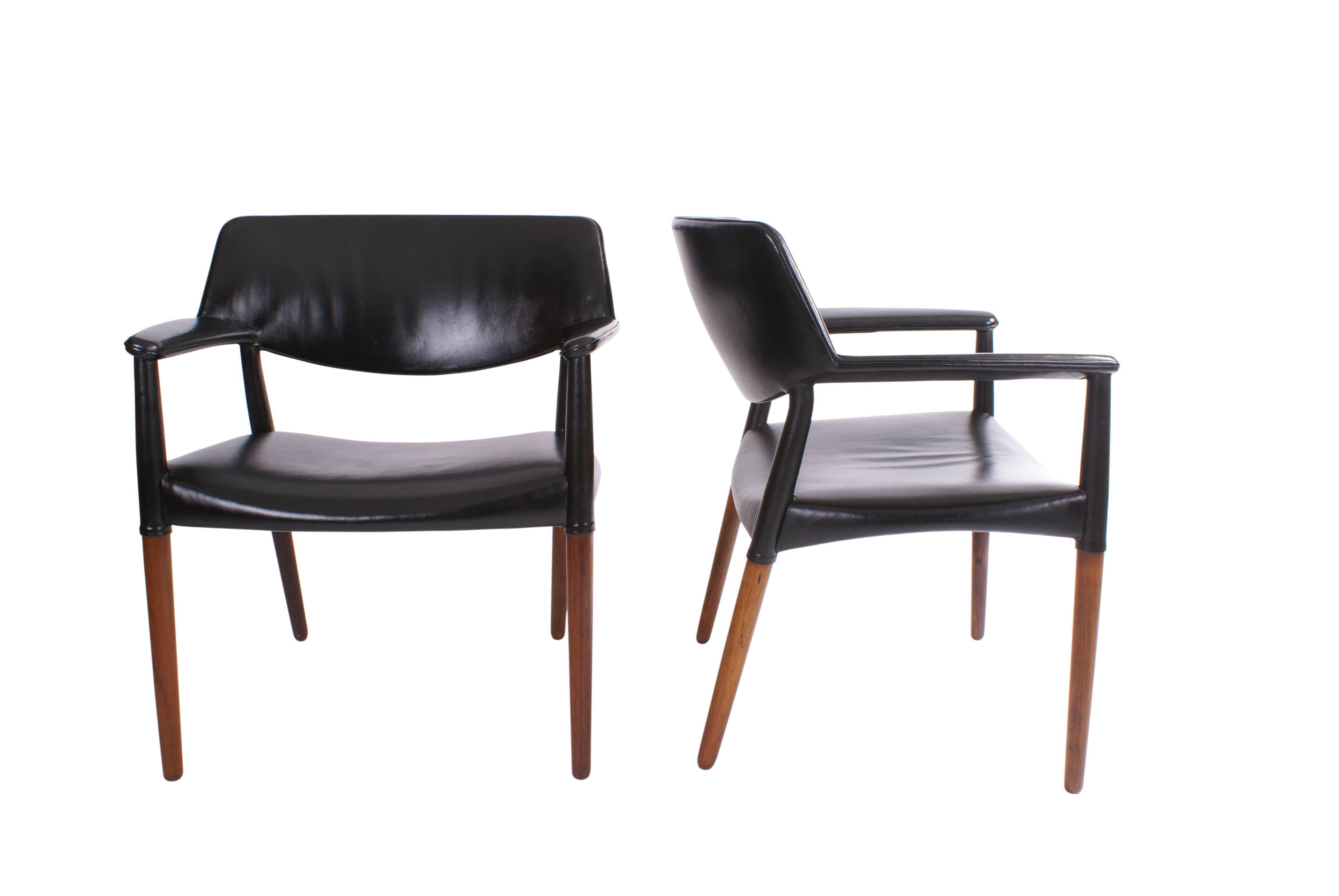 Pair of Ejner Larsen and Aksel Bender Madsen armchairs in Brazilian rosewood made by master cabinetmaker Willy Beck. Upholstered in original patinated black leather.

Discounted worldwide air shipping available on request.