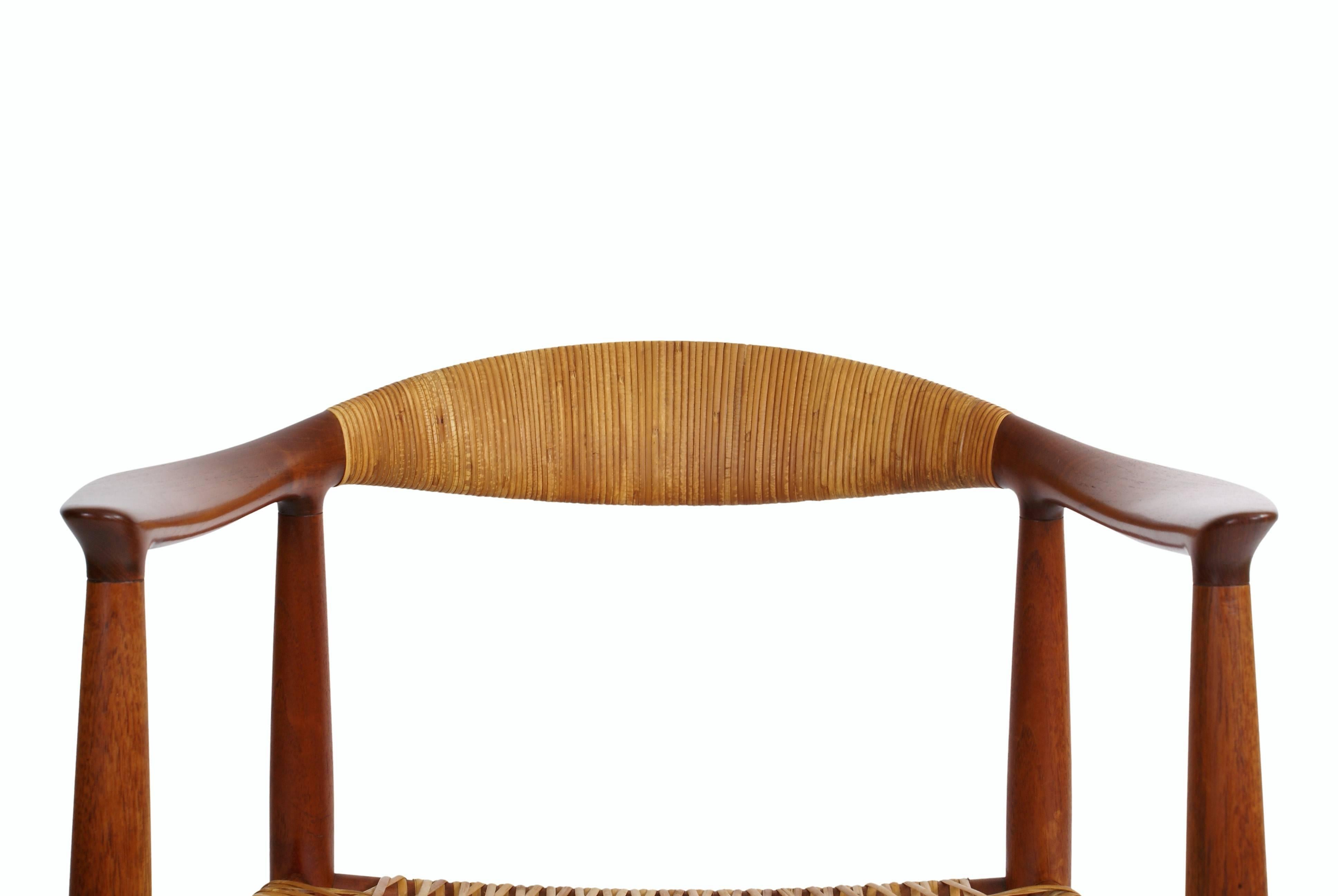 Hans Wegner 'The Chair' for master cabinetmaker Johannes Hansen, model JH503. Designed 1949. Teak and cane. Char stamped from maker. 

'The Chair' was first presented at the Copenhagen Cabinetmakers' 23th Guild Exhibition at The Danish Museum of