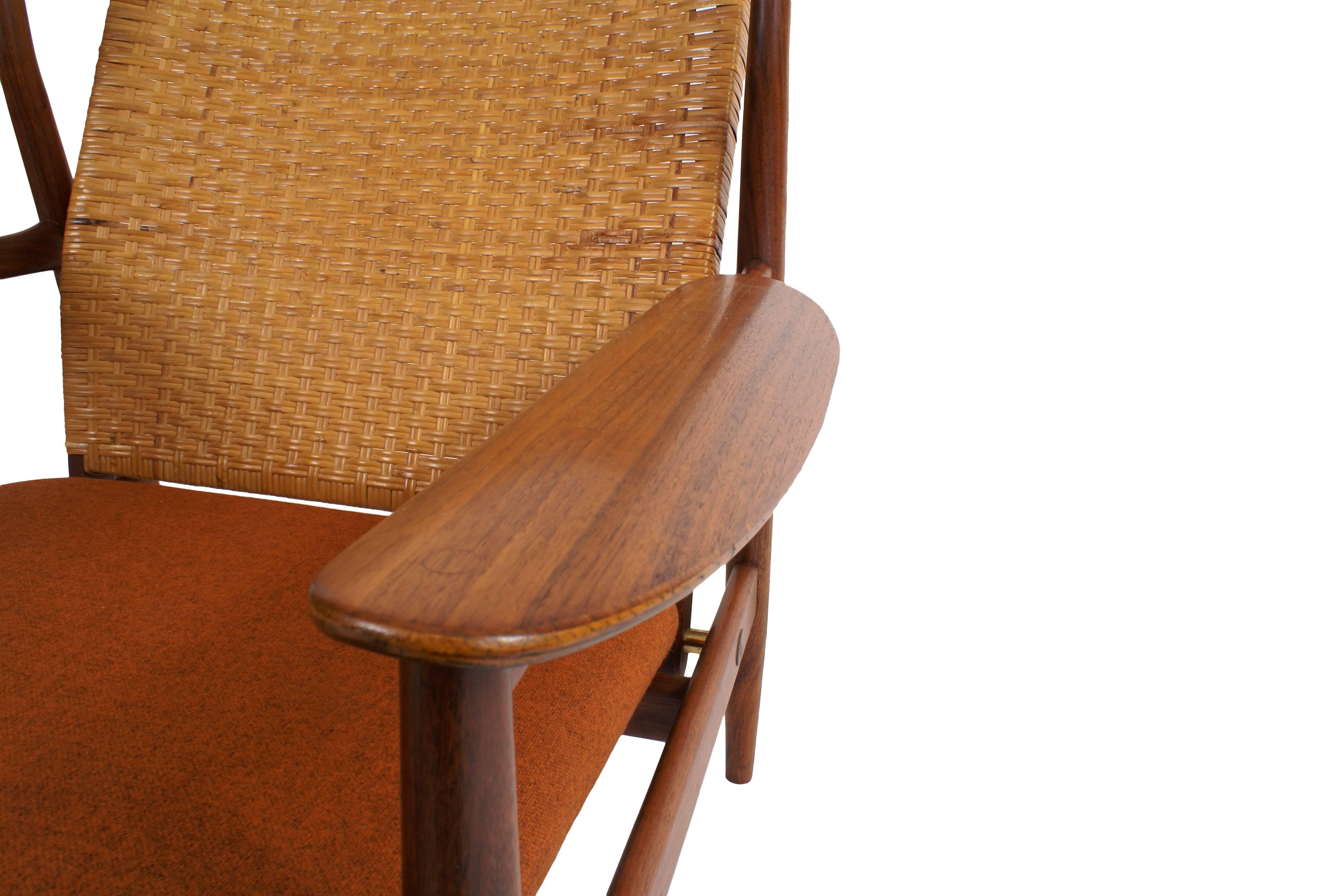 Finn Juhl easy chair for Baker re-upholstered in Kvadrat fabric. Original cane to backrest. Made by Baker, USA, 1960s. Designed 1955.