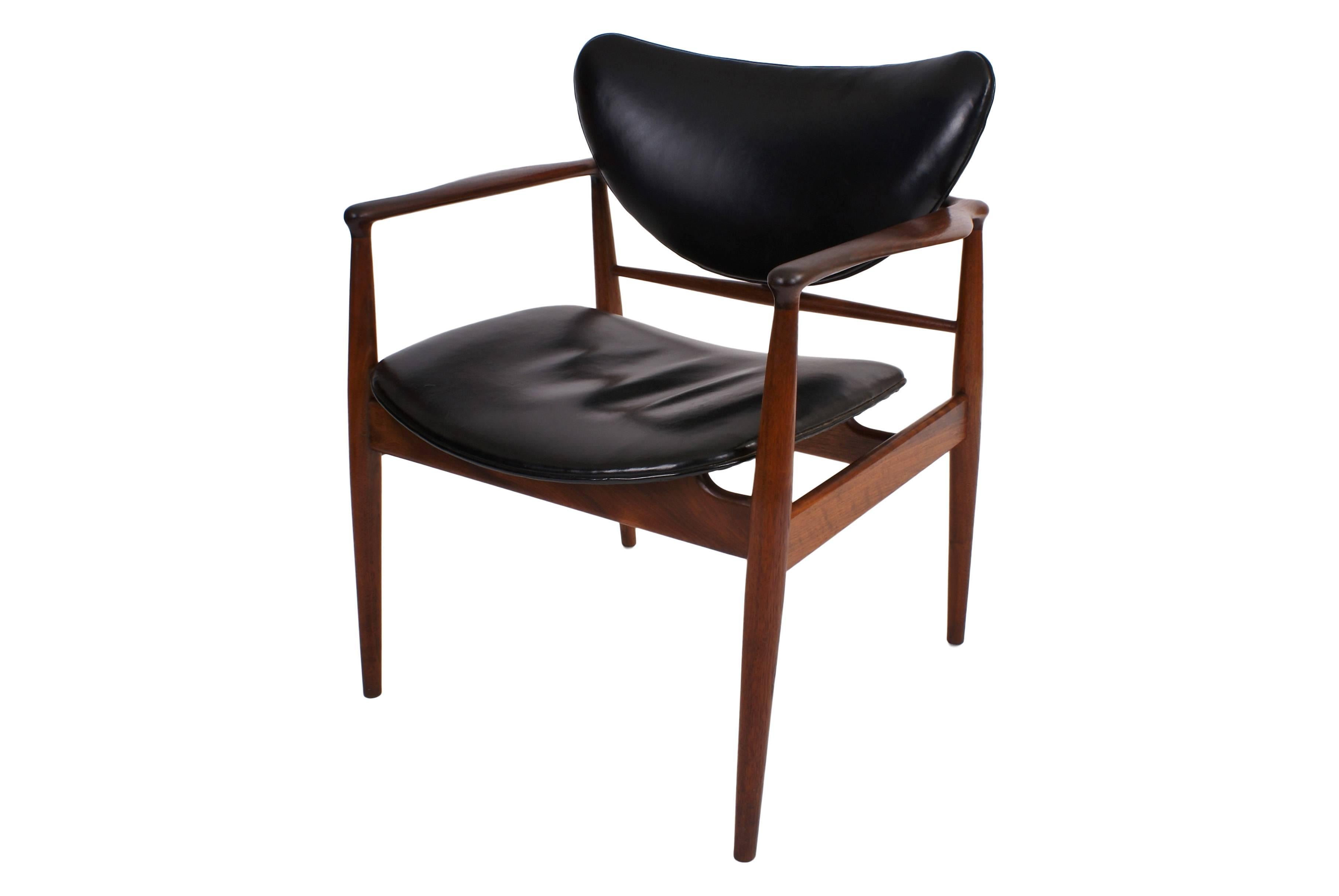 Set of four Finn Juhl FJ-48 easy chairs in teak for Baker, USA, 1950s. Original black leather upholstery. Designed 1948.

Price is for the set of four chairs.