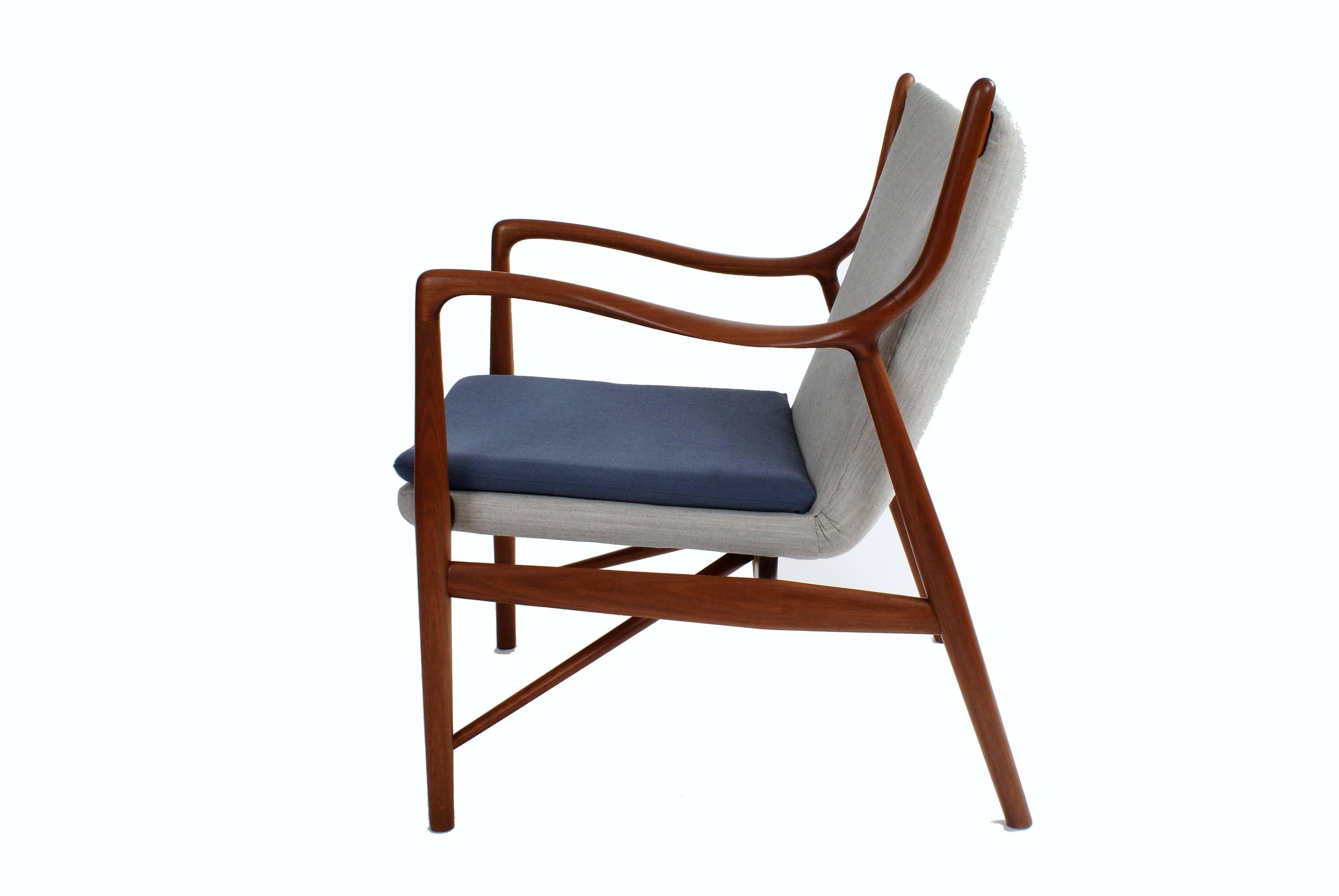 Finn Juhl NV45 easy chair in Cuban mahogany. Executed by cabinetmaker Niels Vodder, Copenhagen, Denmark. Fabric and leather piping. Designed 1945.

Rare version in Cuban mahogany. Similar example in Cuban mahogany exhibited in the Design Museum