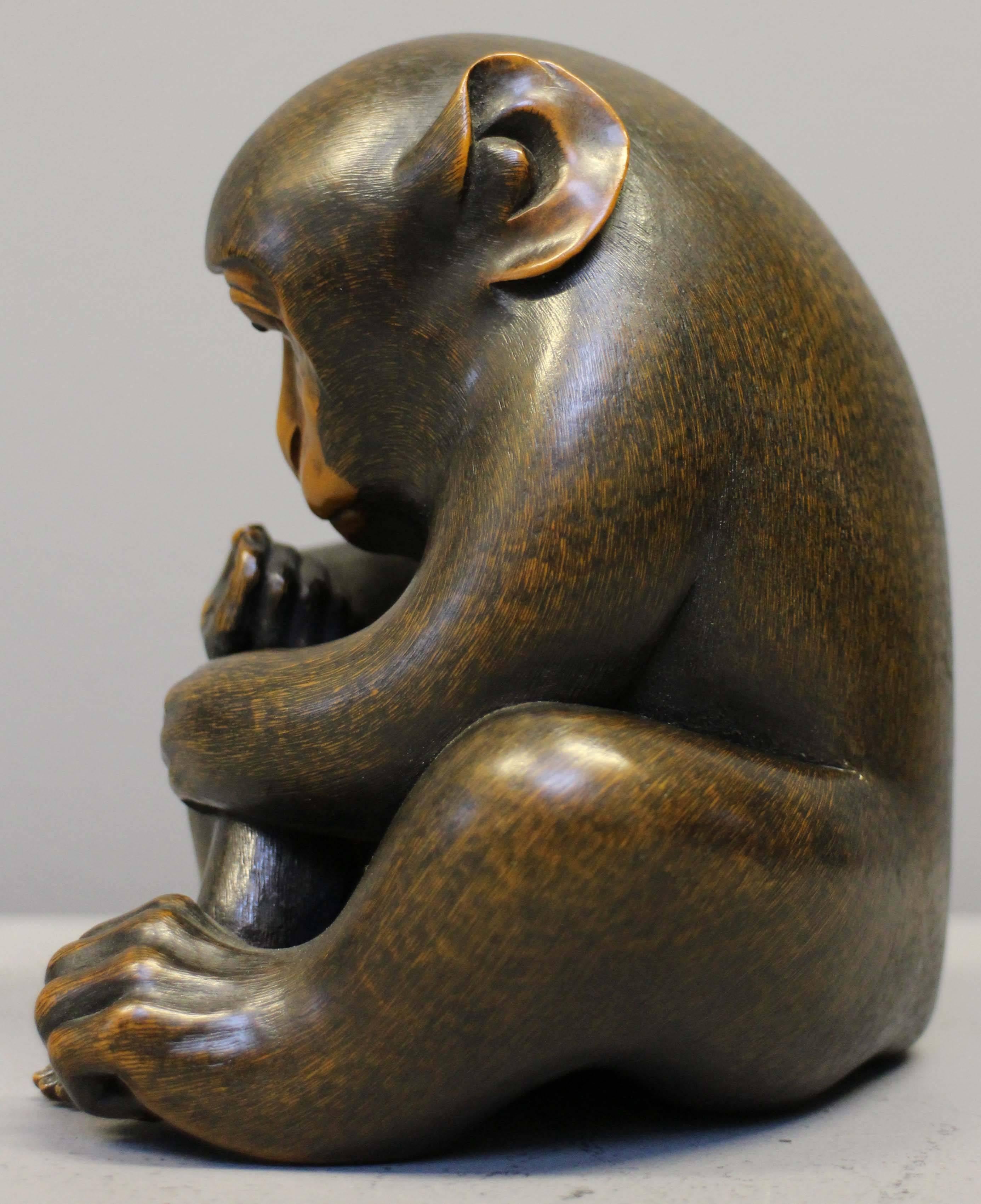 A charming, detailed antique carved wood okimono (Japanese for ornamental object) of a mother monkey grooming her baby.

To enhance and preserve the natural patina of the wood it has been lightly polished with renaissance wax. 
