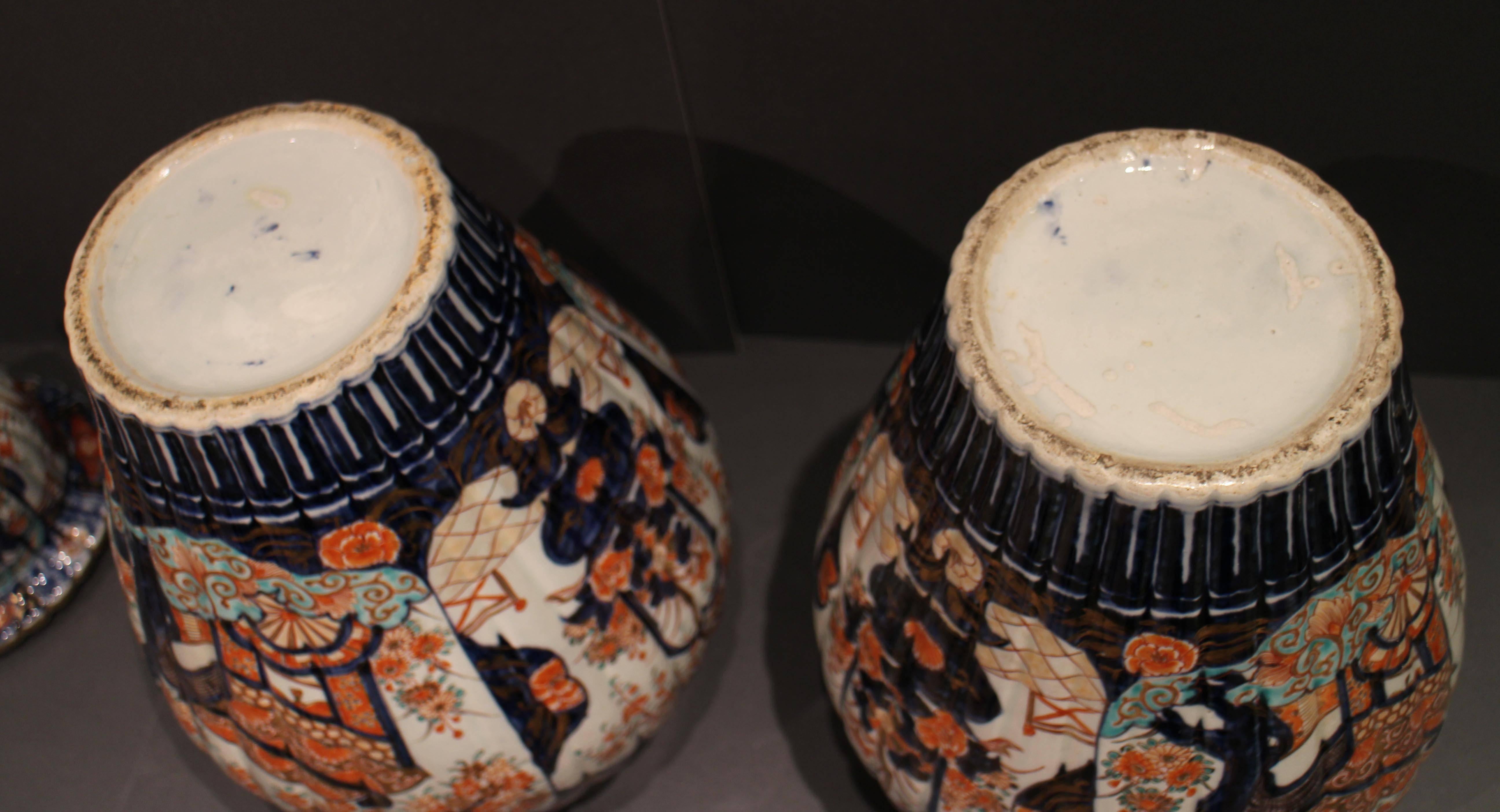Painted Pair of Antique Japanese Imari Vases and Covers Decorated in Blue and Orange