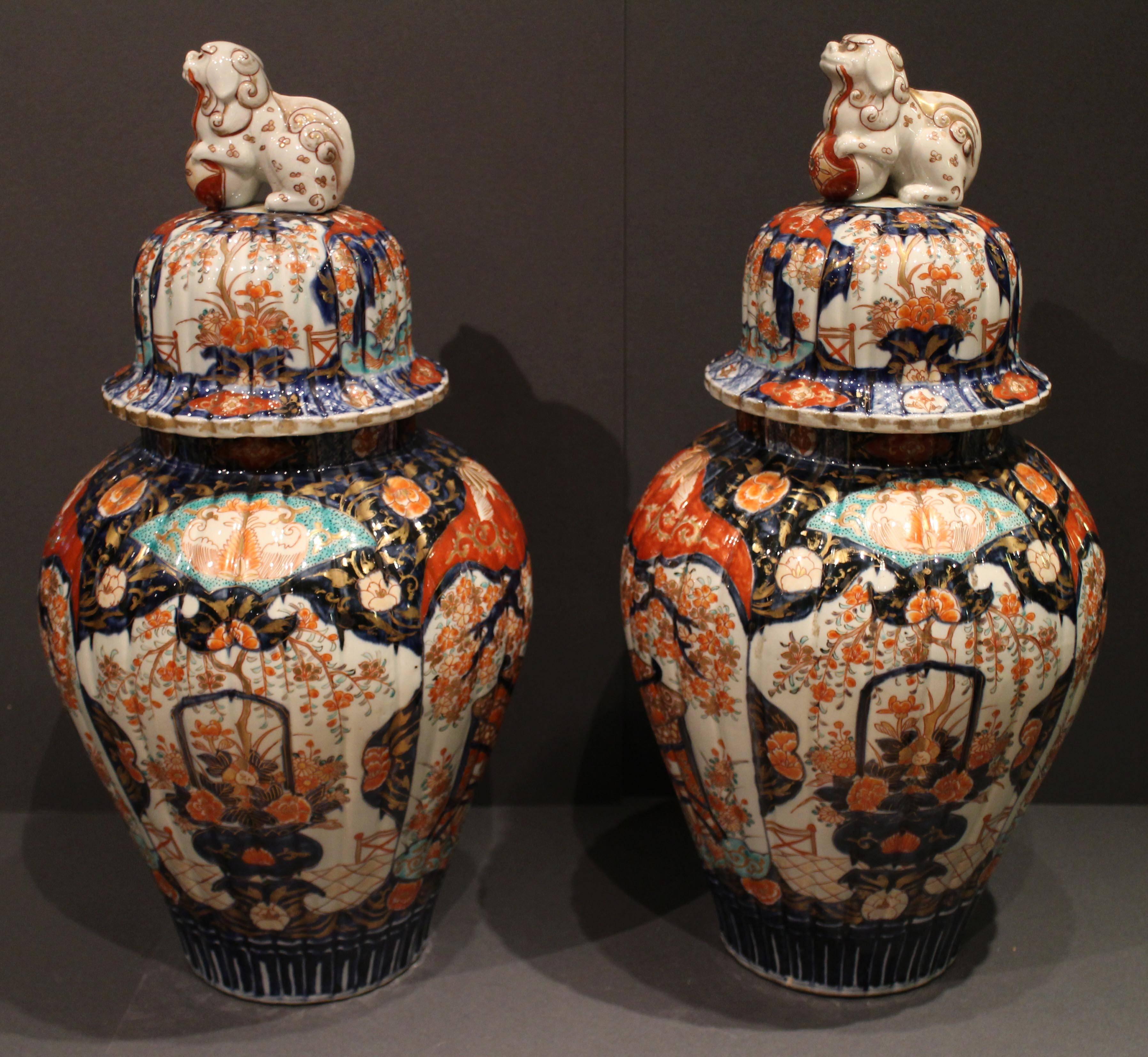 Porcelain Pair of Antique Japanese Imari Vases and Covers Decorated in Blue and Orange