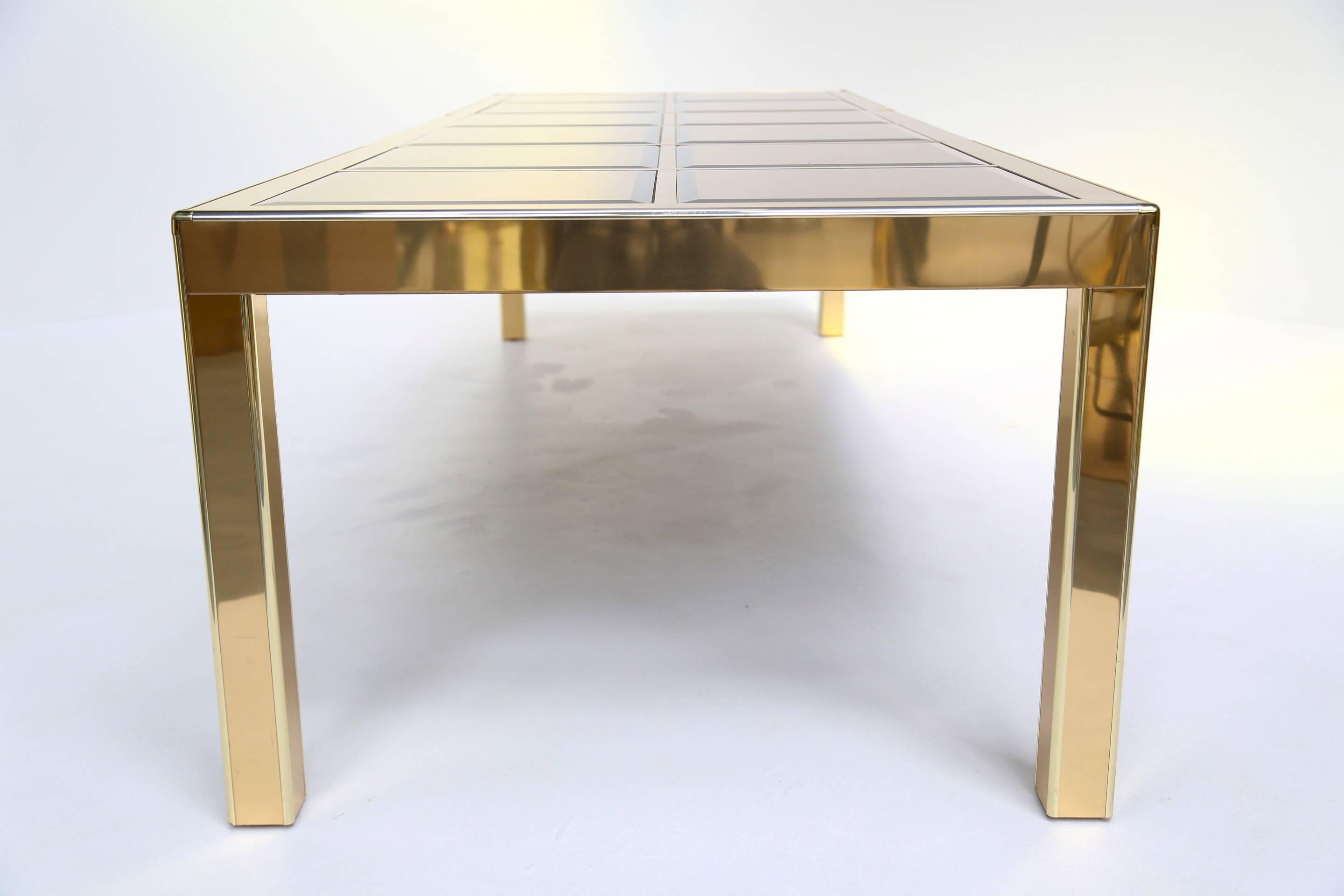 American Mastercraft brass extending dining table with mirrored glass panels.