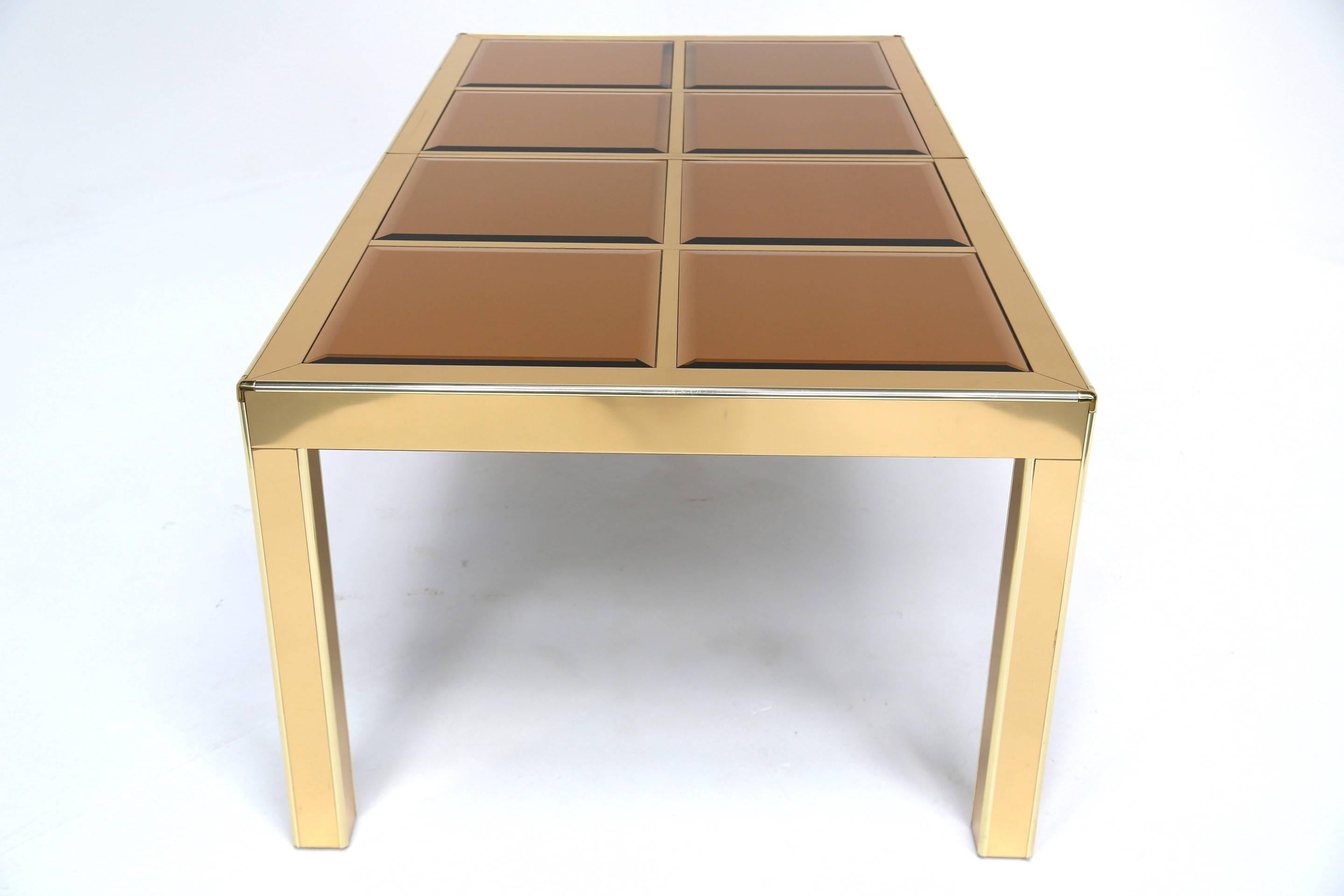 Late 20th Century Mastercraft brass extending dining table with mirrored glass panels.