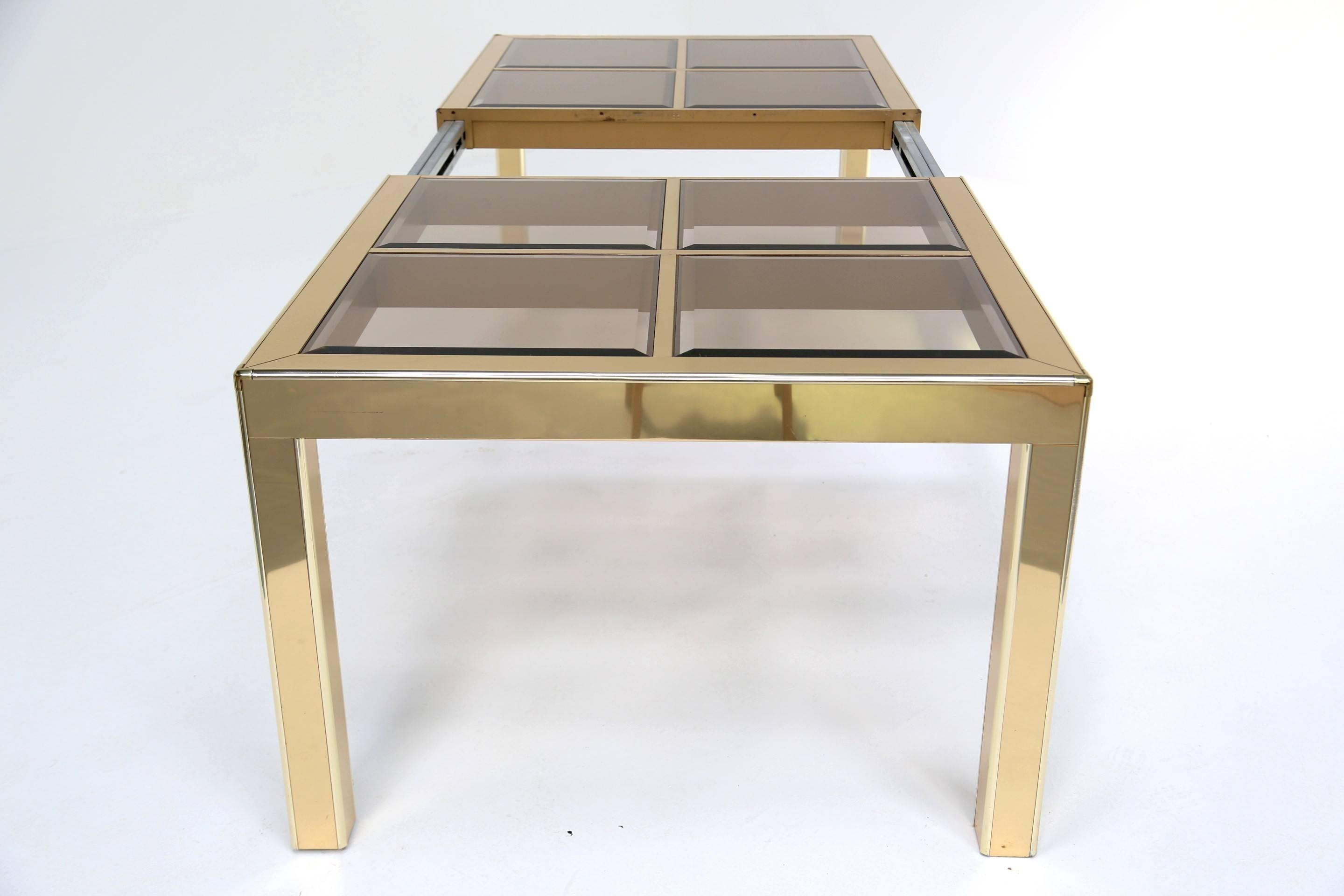 Mid-Century Modern Mastercraft brass and glass mid century extending dining table. For Sale