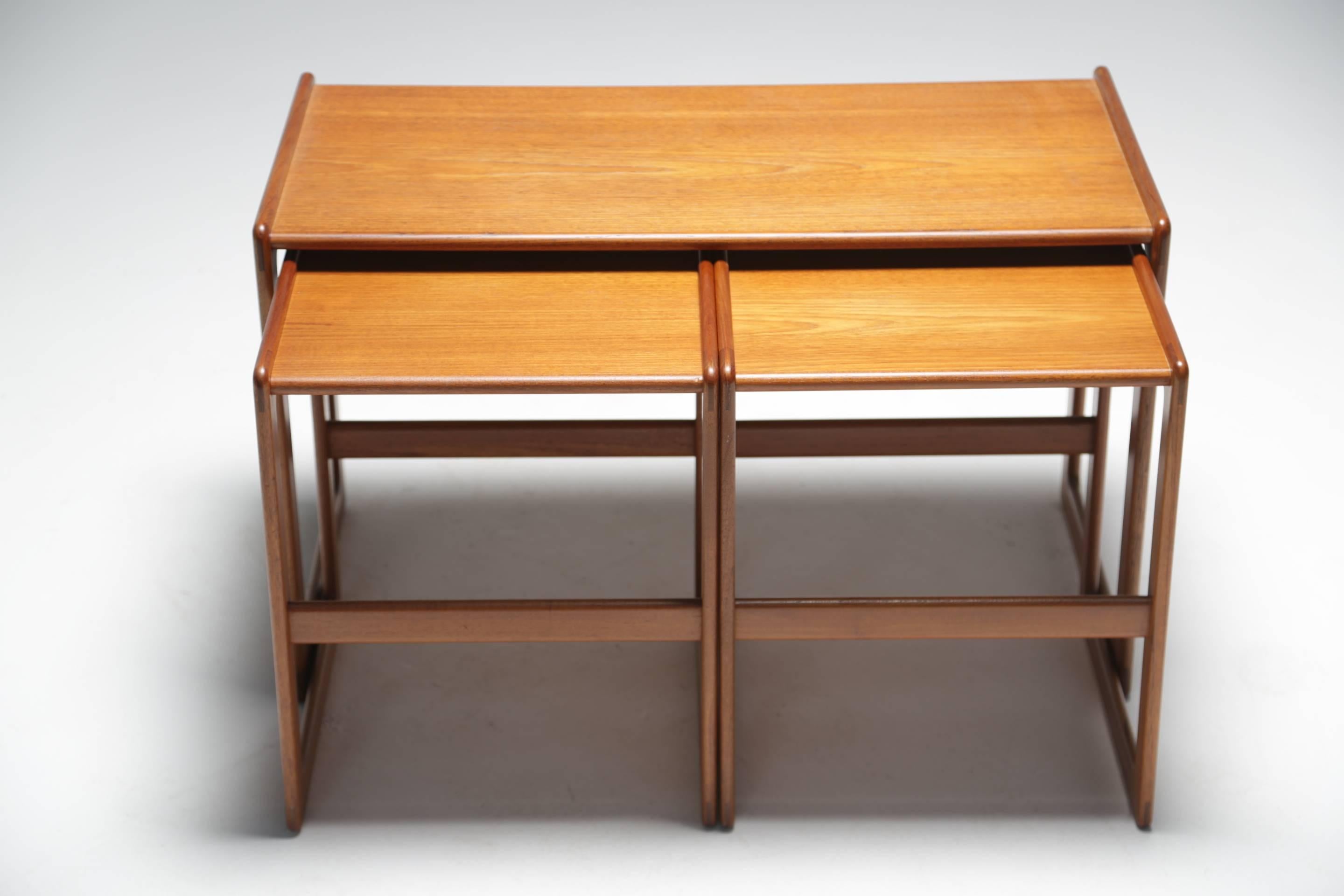 A top quality Scandinavian modern vintage teak set of three nesting tables designed by Arne Hovmand Olsen for Danish furniture maker Mogens Kold.
Beautifully constructed these are a wonderful set of nesting side tables that would compliment any