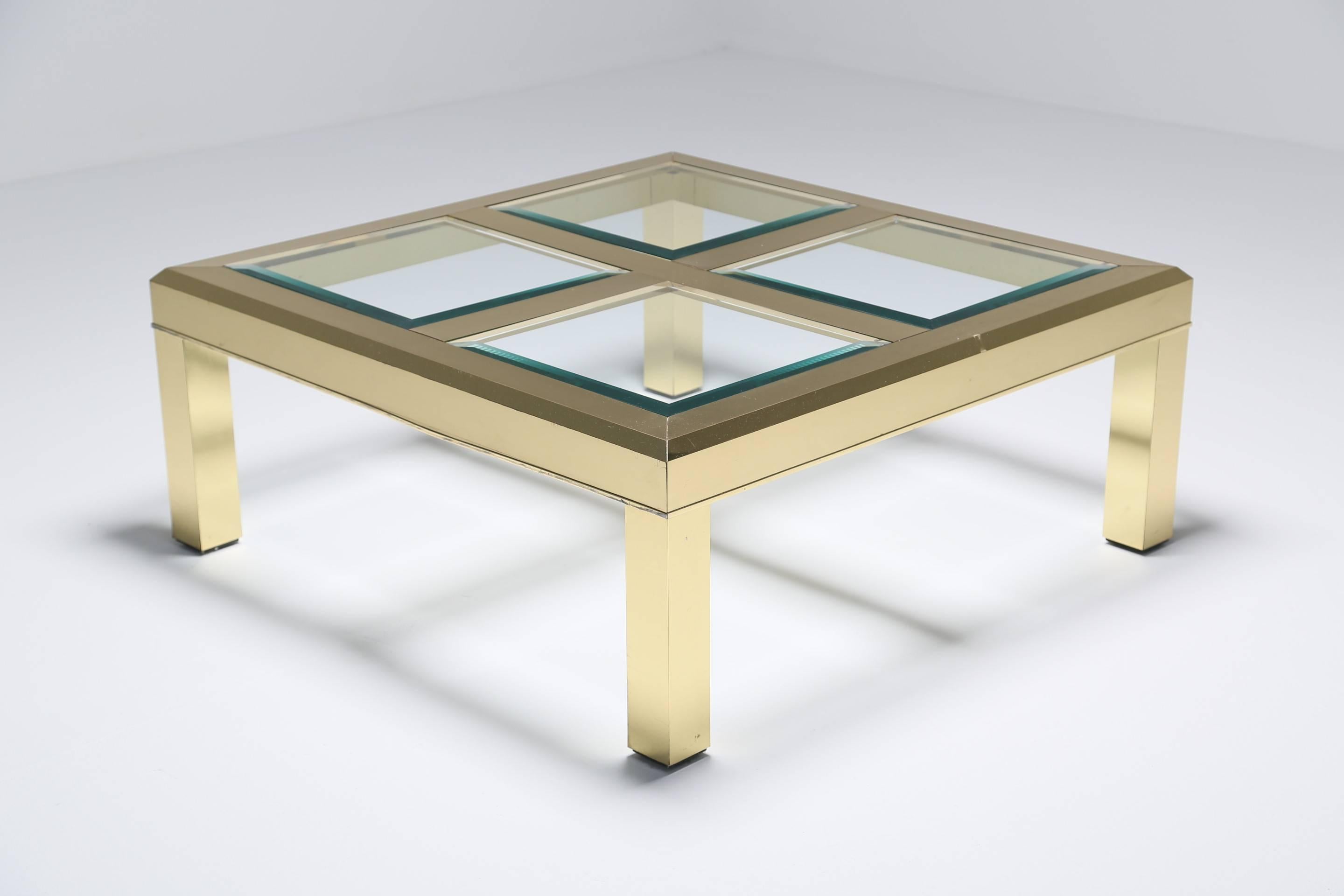 A smart Mastercraft style coffee table in faceted brass and beveled glass.. Simple yet functional in a generous size. 