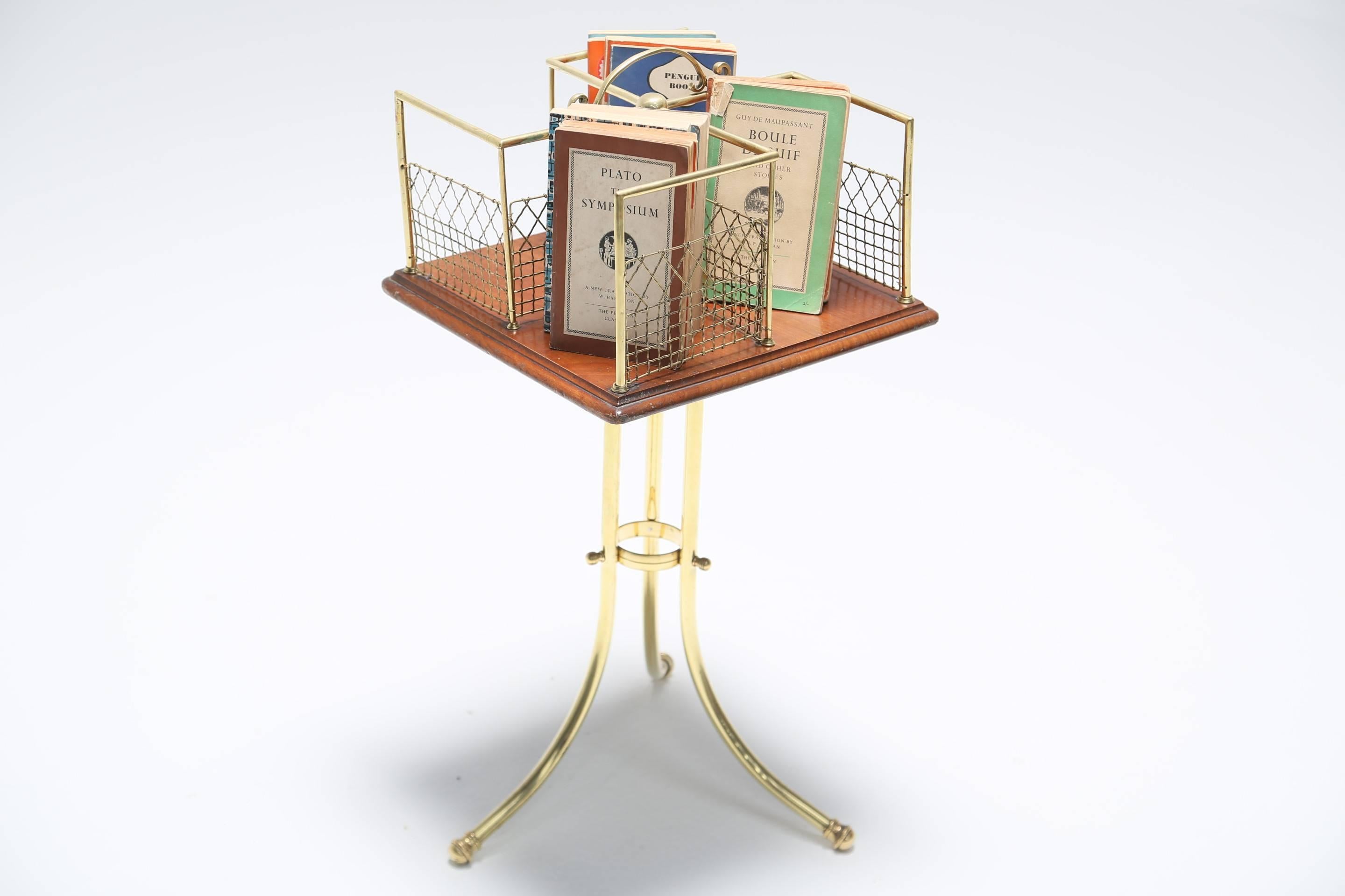 A brass and mahogany Edwardian revolving book stand or book table. A beautifully decorative piece in lovely original condition, possibly French from the Edwardian period.

