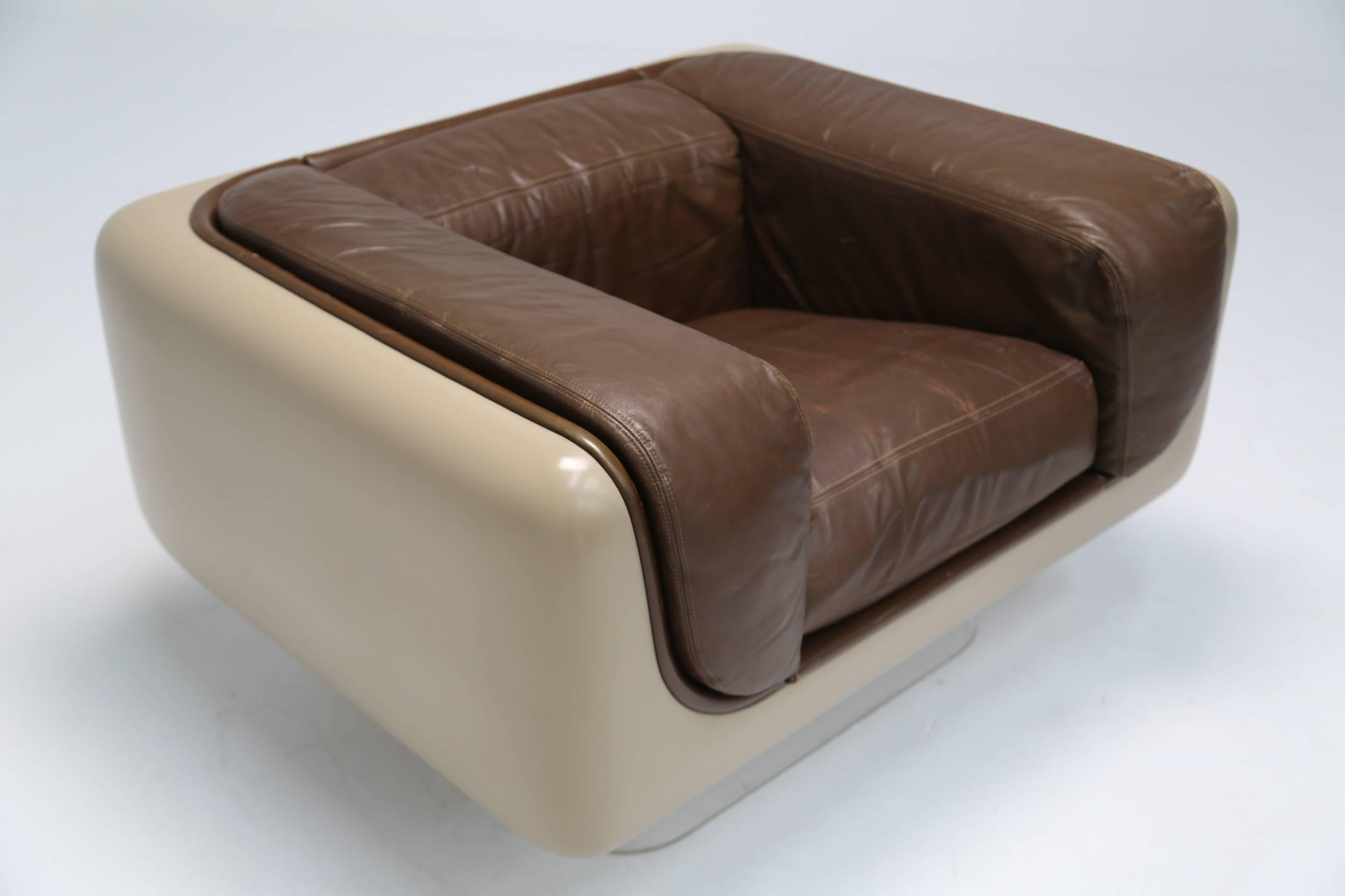 A steelcase soft seating armchair. The soft seating group line was introduced in 1974. Designed by William C (Bill) Andrus, it is made with fibreglass shells over lucite bases, with leather upholstery. The super soft seats are complimented by the