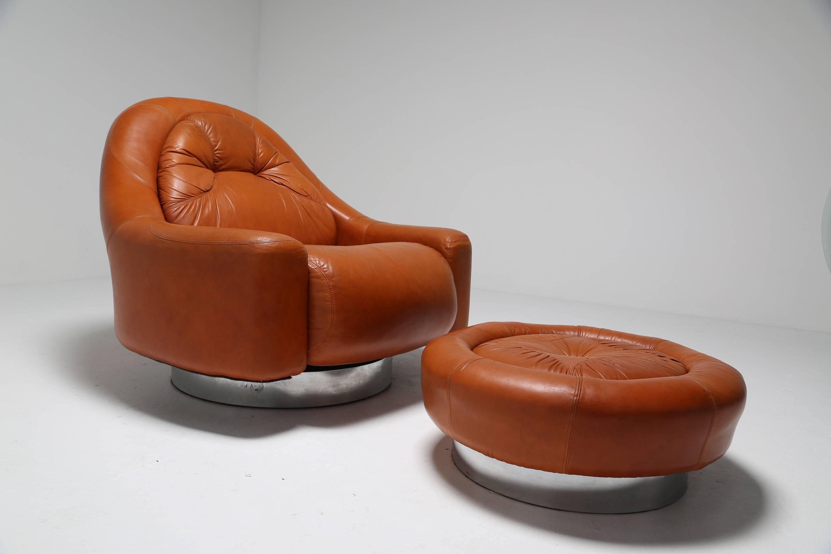 Guido Faleschini designed this supremely comfortable lounge chair and ottoman. Produced by Mairani for Pace in the late 1970s-early 1980s and made from soft but durable tan leather on a steel base. There is no doubt that this seating combination