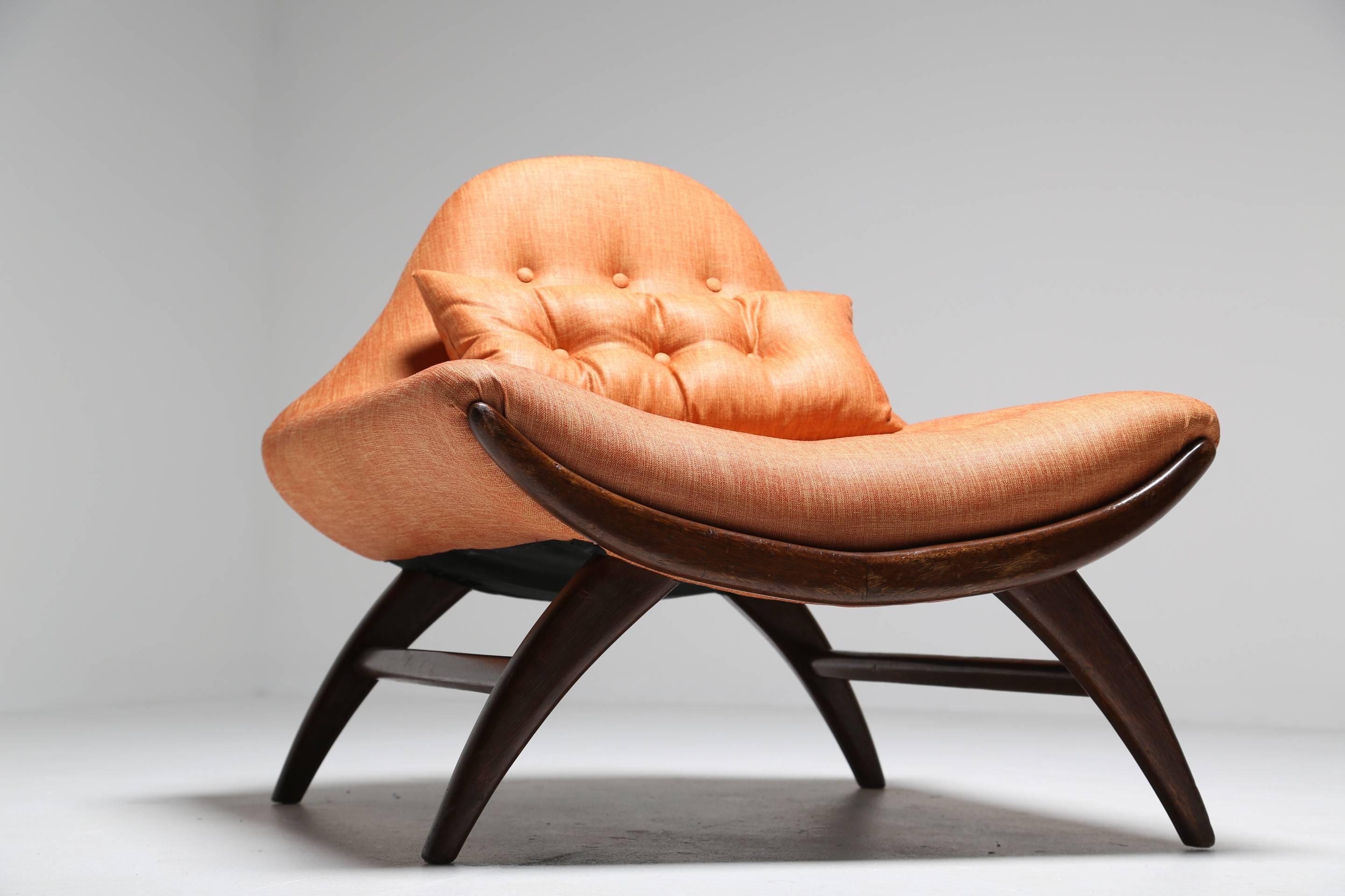 A walnut framed Gondola lounge chair by Adrian Pearsall recently covered in an orange linen, comes with a loose cushion. A very generous sized lounge chair with great Mid-Century styling. Easily shipped anywhere in the world.