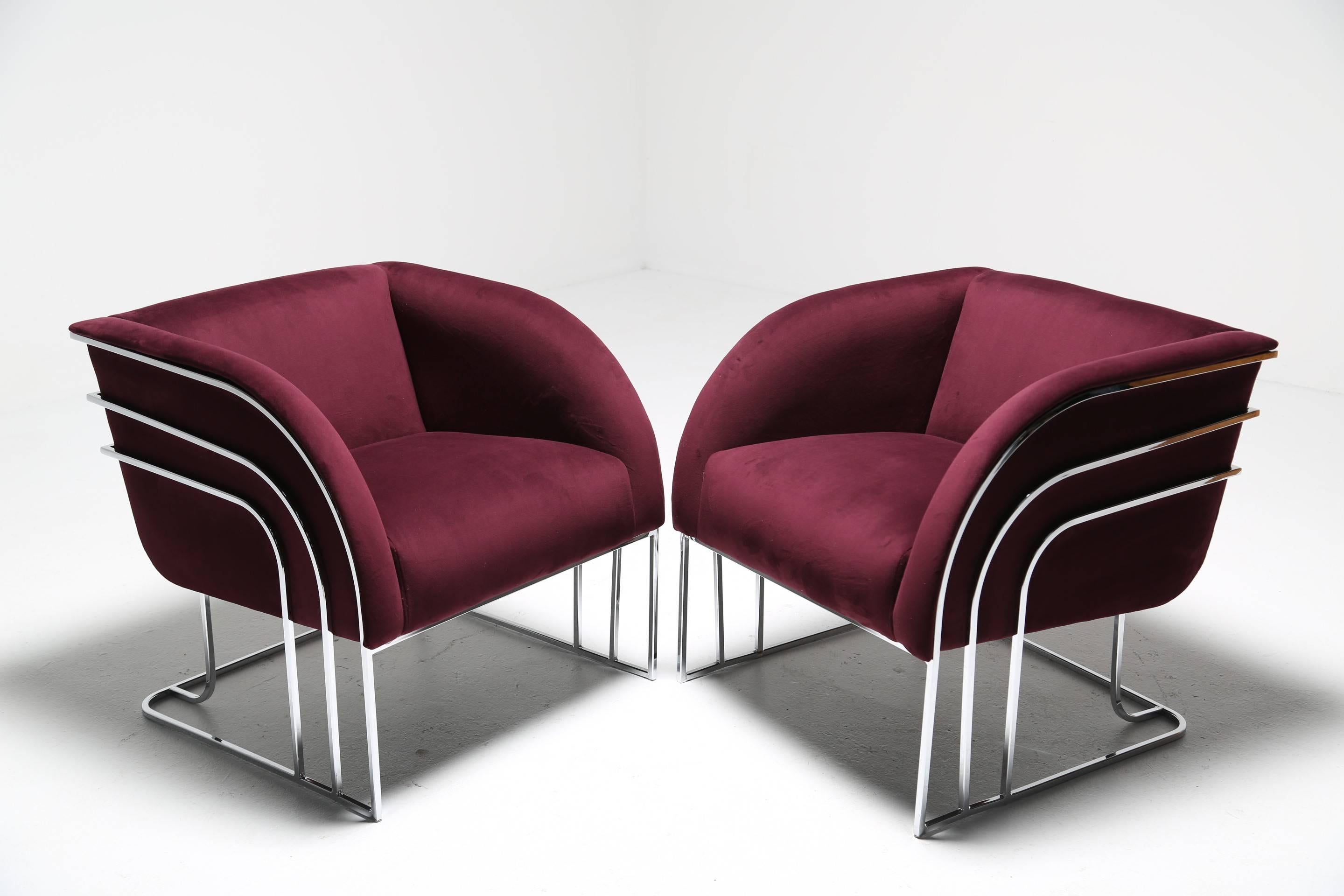 A pair of Art Deco styled chrome frame chairs in the manner of Milo Baughman. A beautifully stylish pair of lounge chairs recently covered in a purple velvet fabric. Very easily shipped worldwide.