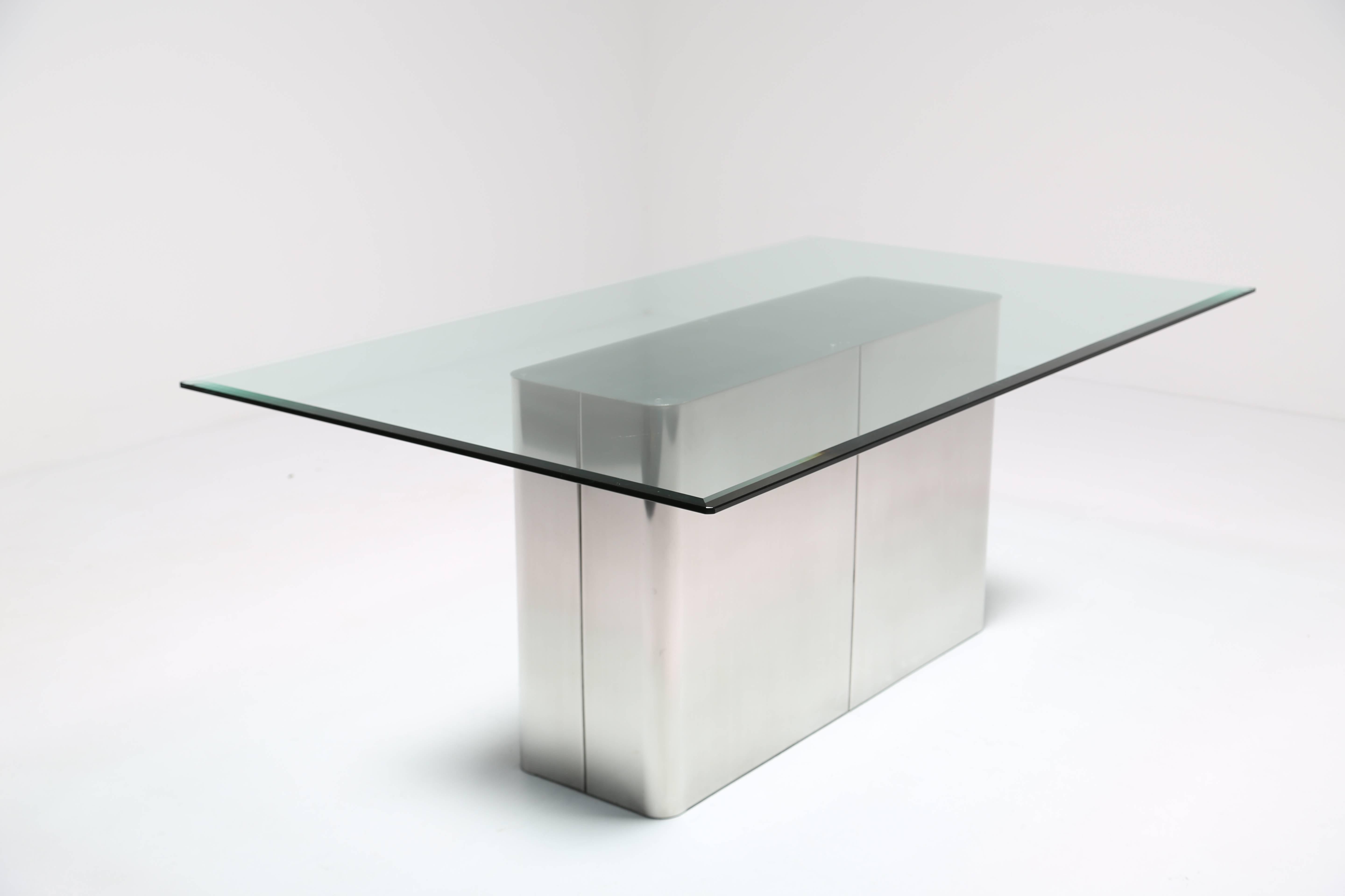 Mid-Century steel six-seat dining table base with beveled glass top. A table similar to this appears in Thayer Coggin catalogue so we believe this to be a Milo Baughman design. We added the glass top as we received only the base originally. The