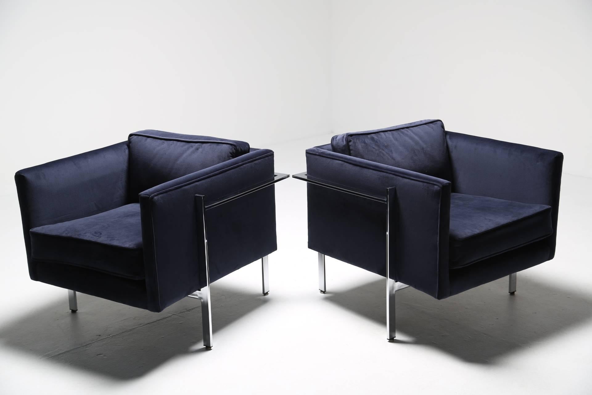 A pair of Mid-Century Modern lounge chairs by Milo Baughman for Thayer Coggin. Recently recovered in a navy blue velvet fabric. A nice comfortable deep pair of armchairs. Matching sofa is also available in a separate listing. Possibly two of the