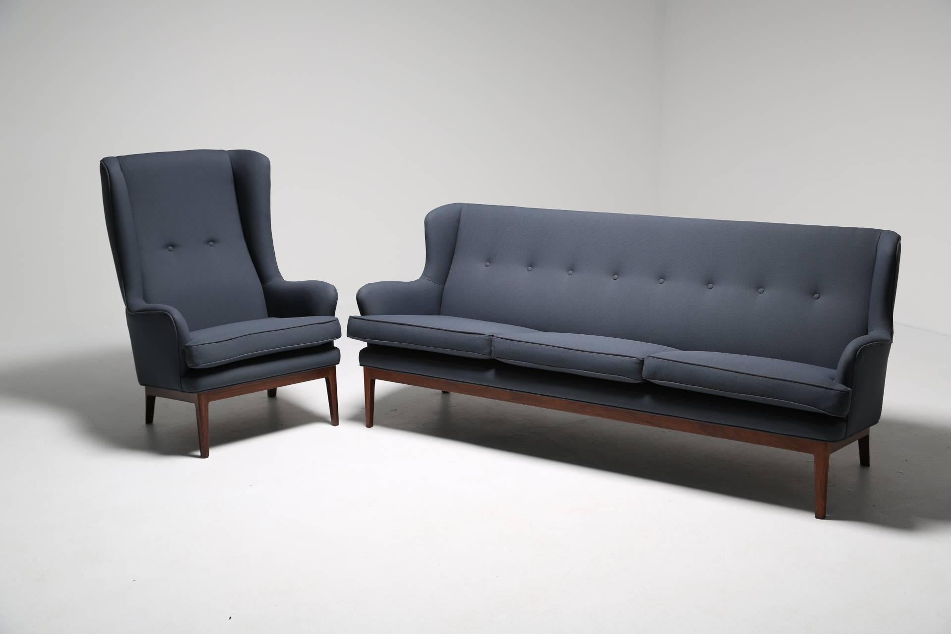 Fabric Arne Norell wing armchair, hardwood frame, Scandinavian modern 1960s.