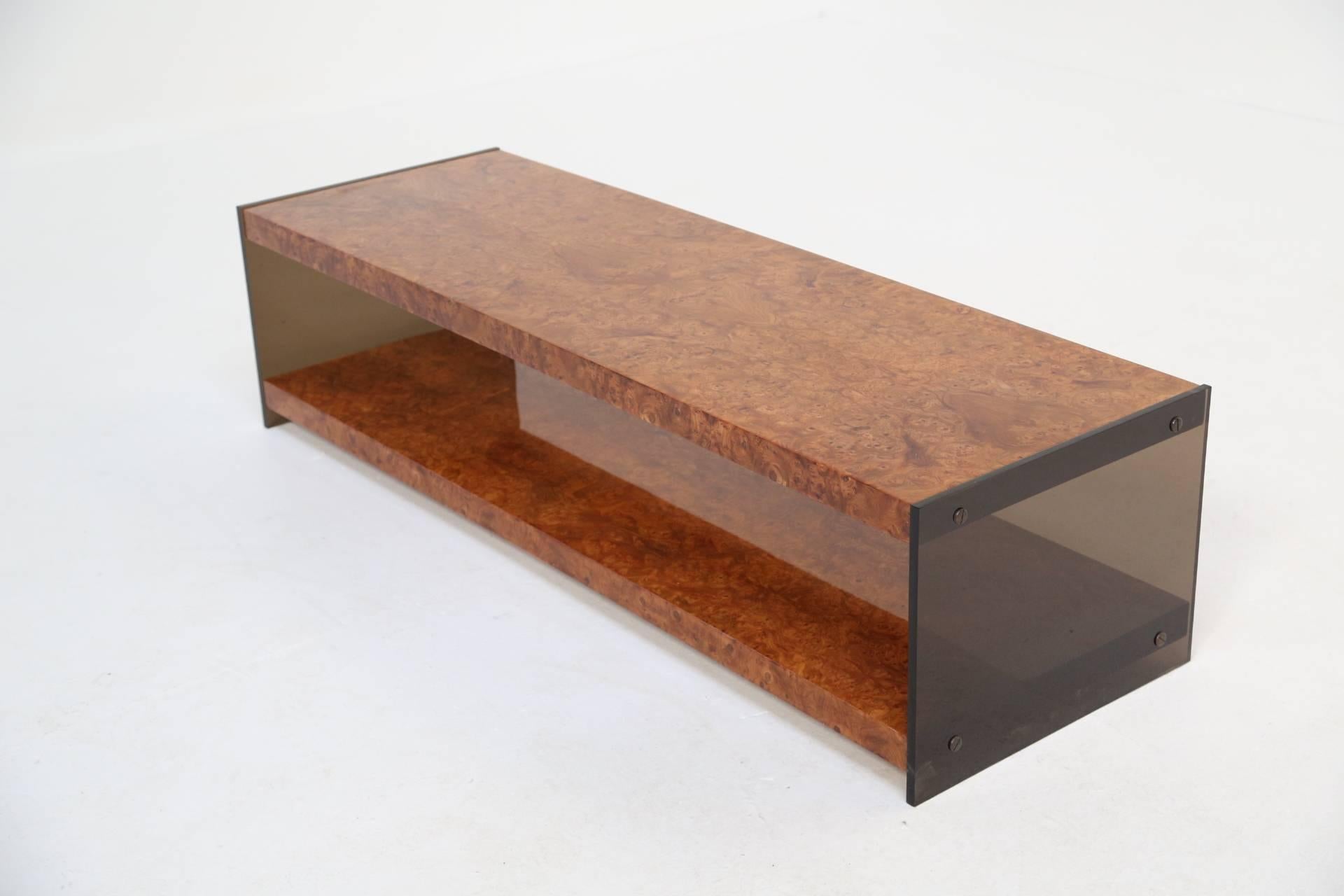 A burl wood two-tier coffee table with glass ends by Milo Baughman for Thayer Coggin. In immaculate condition this two-tier table has all the looks and also has plenty of space for coffee table books etc.
 