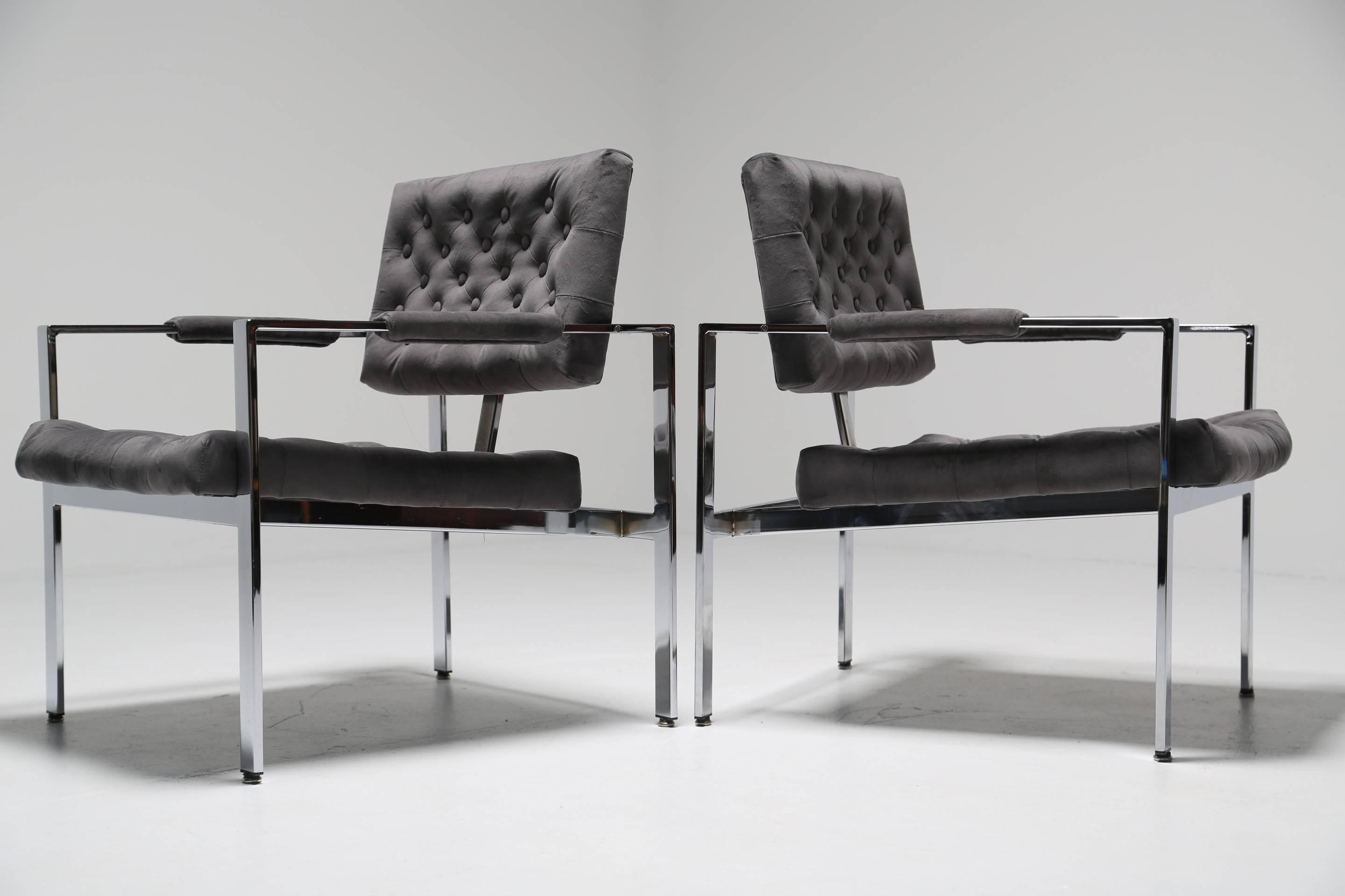 These dramatic pair of pure luxe vintage chrome frame tufted lounge chairs covered in a plush grey velvet crave the limelight. Typical of Milo Baughman's sleek and sophisticated 1970s style, these iconic chairs remain timelessly chic. It is no
