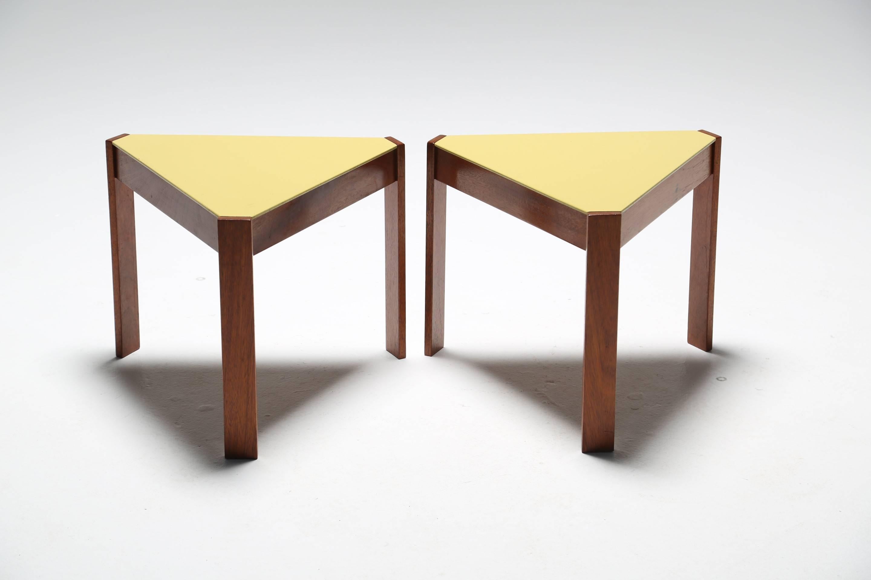 We love the geometric quality to this pair of unusual and rare vintage teak side tables with painted yellow tops. They have a fun and quirky appeal that could brighten up any interior and we think that they would look just as good in a living room