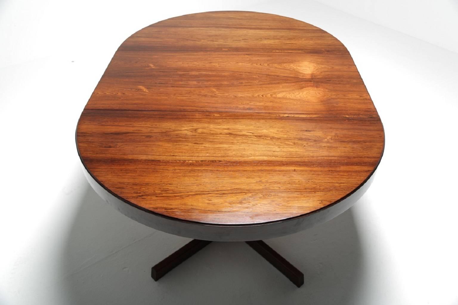 This vintage Danish tropical hardwood extending pedestal table is a rare and beautiful thing. Attributed to the great Danish designer Kai Kristiansen, it does indeed have all the hallmarks of a Kristiansen creation. Expertly made from stunning