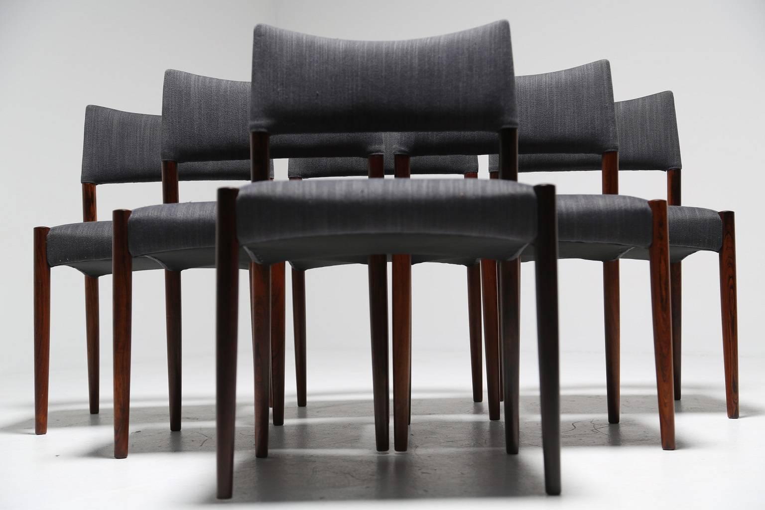 Danish designer V.S Andersen created this smart set of six tropical hardwood dining chairs in the 1960s. Not only are these chairs beautifully crafted but they are also very comfortable and supportive. Newly upholstered in a gun metal grey fabric,