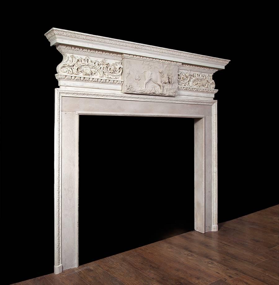 A finely carved 18th century pine and Portland stone chimneypiece in the manner of Sir Henry Cheere.

The top layer of the shelf is moulded and carved with a row of acanthus leaves, this decoration also features on the jambs. The bottom layer of