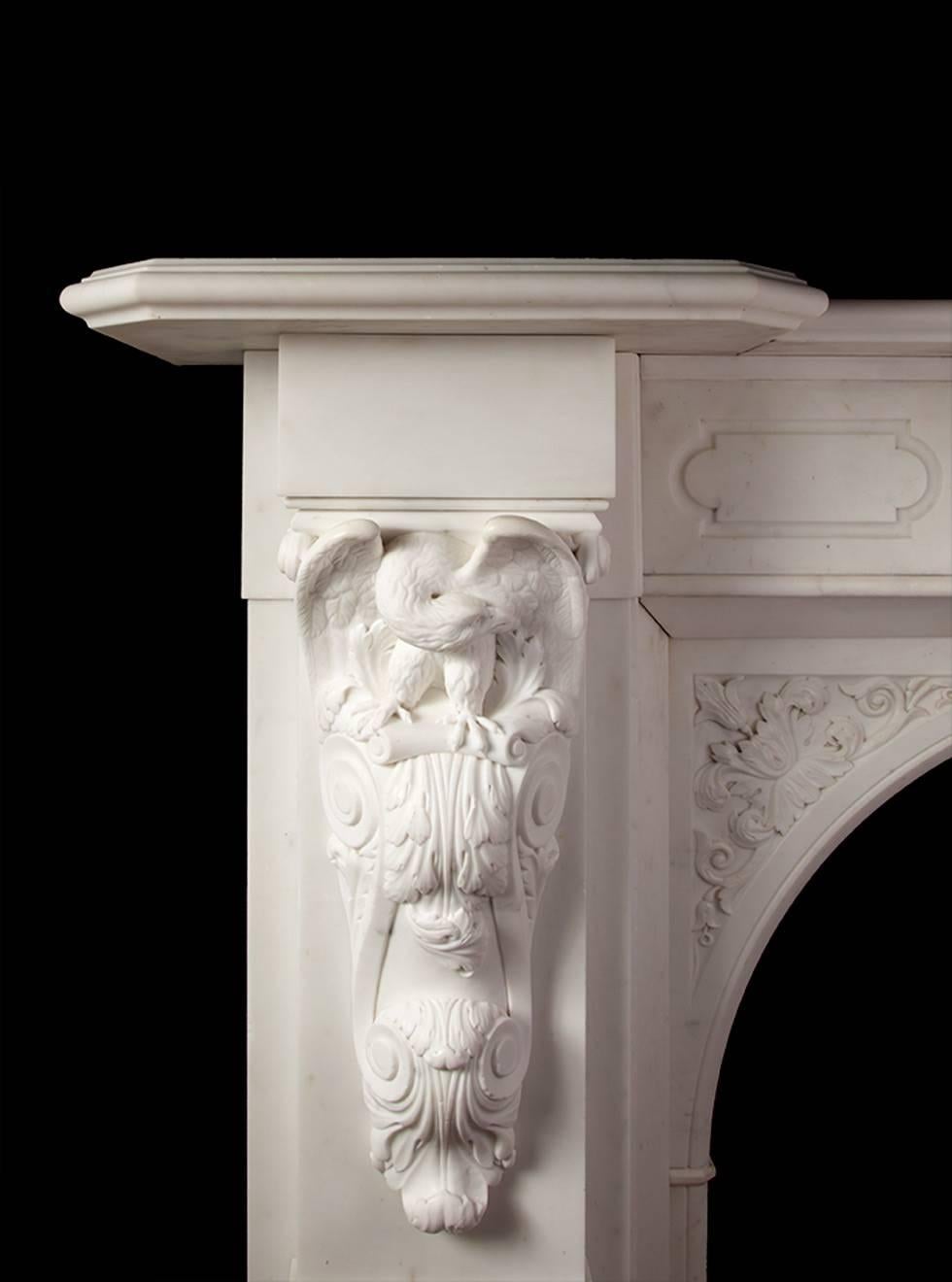 Impressive mid-19th century carved statuary marble fireplace. The fireplace has a deep and moulded break fronted shelf, upheld by two large carved corbels with perched eagles, preening themselves. The centre plaque depicts Zeus with his trident, in