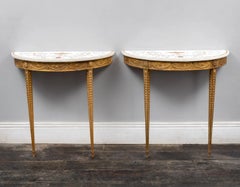 A pair of 18th century giltwood tables with Bossi marble tops